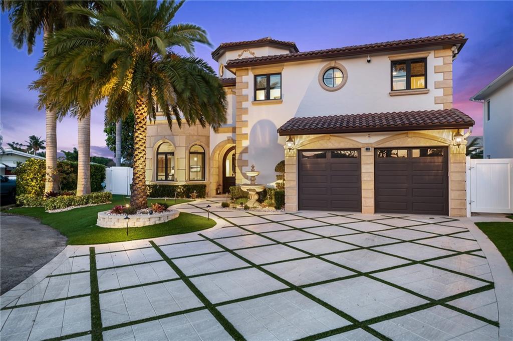 Welcome to paradise! This elegantly finished home has been impeccably maintained and is ready for an owner of discriminating taste.  The 6-bedroom, 6.5 bath home features marble floors, vaulted ceilings, beautiful dark wood trim and solid doors, grand staircase, and carved limestone fireplace.  This home checks all the boxes with full house generator, 95' concrete dock with 27,000 lb. boat lift, east exposure on the pool, patio and back yard, and is located at the end of a cul-de-sac street with no traffic.  Luxurious master suite has beautiful views with a balcony that overlooks intersecting canals, his and her baths, steam shower, and 2 very large closets with custom cabinetry.  Truly an ideal location to enjoy everything that south Florida has to offer.  This exquisite home won't last.