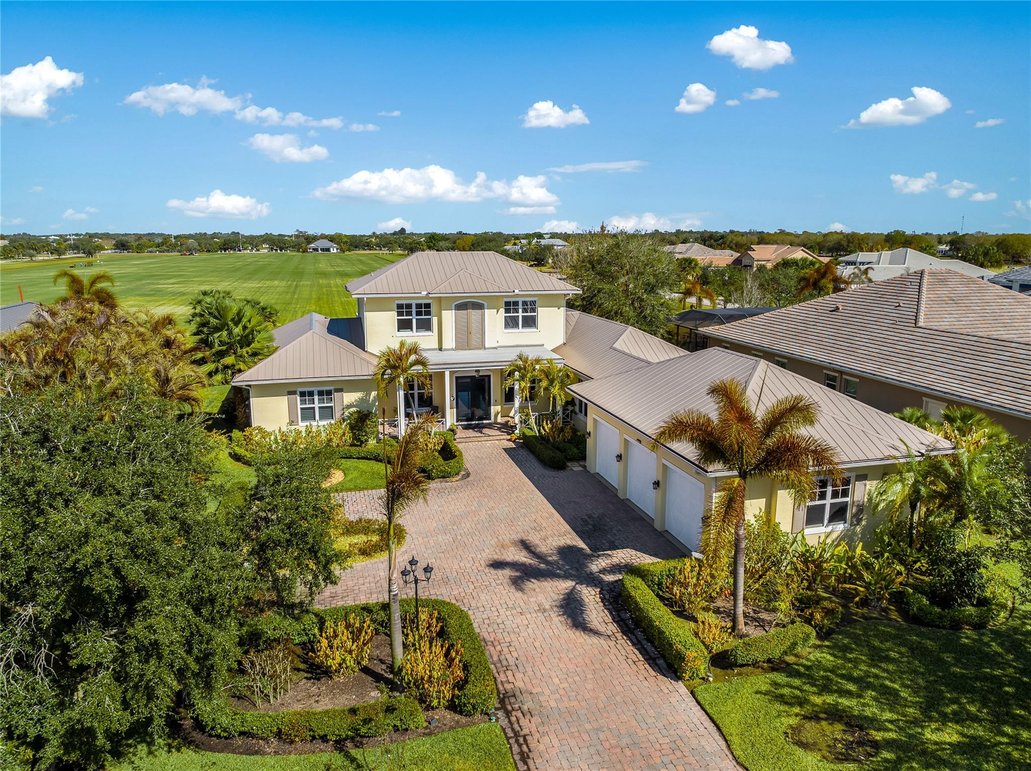 Located within the gated Polo Grounds, this custom home offers exceptional views of the polo field. With over 3,000 square feet of living space, the home features an open floor plan with tray ceilings and spacious living and dining areas ideal for entertaining. The gourmet kitchen features Wolf and Sub-Zero appliances, custom cabinetry, and granite countertops. The first-floor primary suite offers a spacious retreat, while the upstairs veranda provides a front-row view of polo matches, sunsets, and rocket launches. A three-car garage and additional parking for guest in a large driveway.
