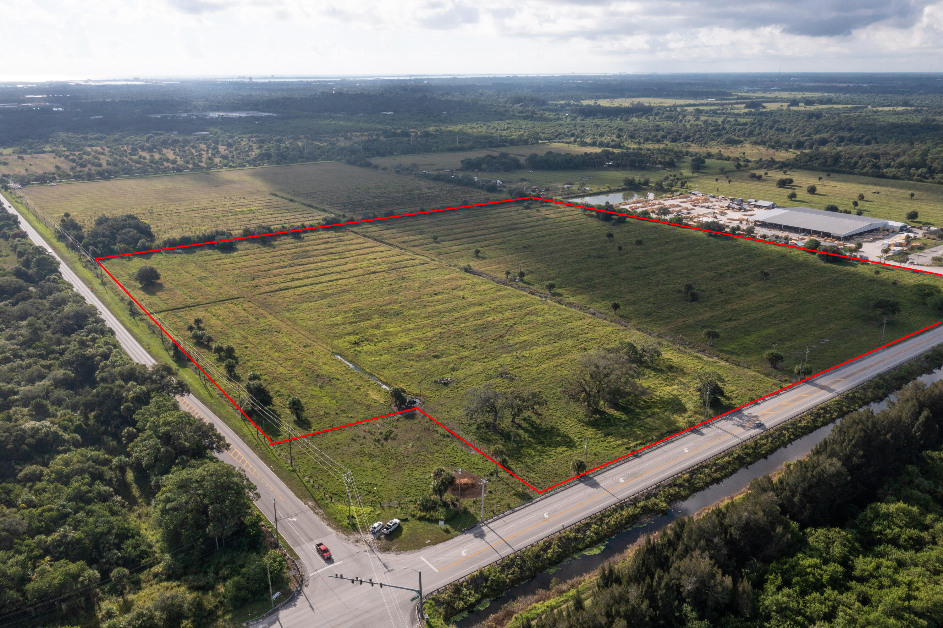 33 +/- acres with over 1,500 feet frontage  Kings Hwy and St Lucie Blvd frontage.  Area of rapid industrial growth.  Kings Hwy is undergoing a $100 million+ road widening project.  St Lucie Blvd is planned to be extended to I-95 and Florida Turnpike in the future.  Several million square feet of industrial projects are under construction or being planned for the Kings Highway corridor.  This property is mostly cleared. Huge Auto Vault property under construction 2 properties to the East.  Join new Thermo King &  new Kelly Tractor and more on Kings Hwy.
See under documents tab -Transportation Planning Organization (TPO) on Kings Hwy widening and Airport Connector(extension of St. Lucie Blvd to I-95 & Turnpike) and joint driveway easement for NE corner of property at St Lucie Blvd
