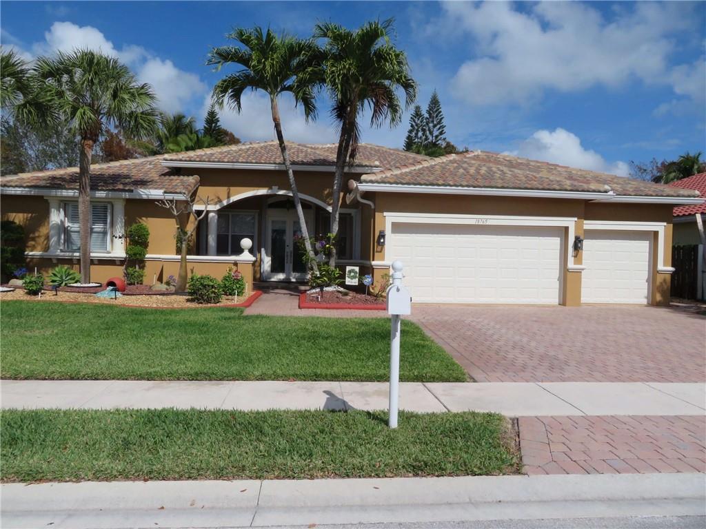 Immaculate and spacious four bedroom, three full bath ranch built on oversize lot in the highly sought after Encantada community in Pembroke Pines. Split floorplan with master suite on opposite side of the house. New roof, gutters and exterior paint (Nov. 2020). Italian porcelain tile throughout the main living area. Bamboo wood floors in all bedrooms. Marble tiled bathrooms. Kitchen has stainless steel appliances and granite countertops. Large covered and screened lanai with wood tile. Backyard faces protected wetlands providing complete privacy. Gated community with many amenities. Excellent location