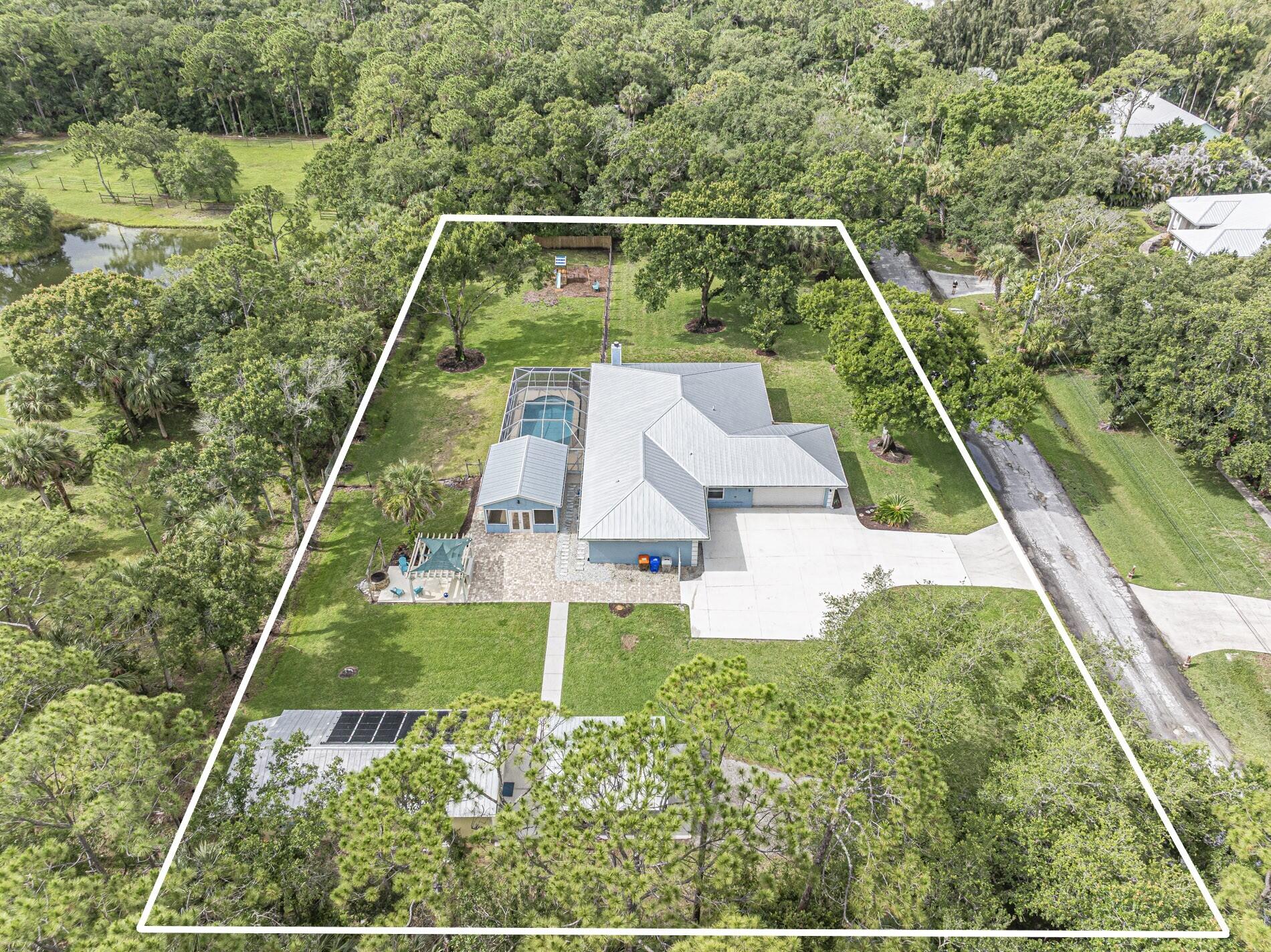 Beautifully maintained 4br/2ba CBS home on over an acre of fenced land in peaceful rural setting w/mature, pristine oaks on a quiet dead end street. This updated property features brand new impact doors & windows, metal roof a custom Pergola & grilling area w/pavers overlooking a newly resurfaced solar heated sparkling saltwater pool, perfect for entertaining. A 600sq ft detached flex space w/walk in shower & kitchenette adds endless possibilities. 2 car garage + carport, A whole house reverse osmosis system in a separate water treatment storage area. Open spaces, fenced yard, pride of ownership throughout make this property a truly rare find offering privacy, functionality while only minutes from all amenities. Enclosed Fl room w/fireplace not incl. sq ft.  No HOA, horse welcome!  possible owner financing with acceptable terms and conditions.