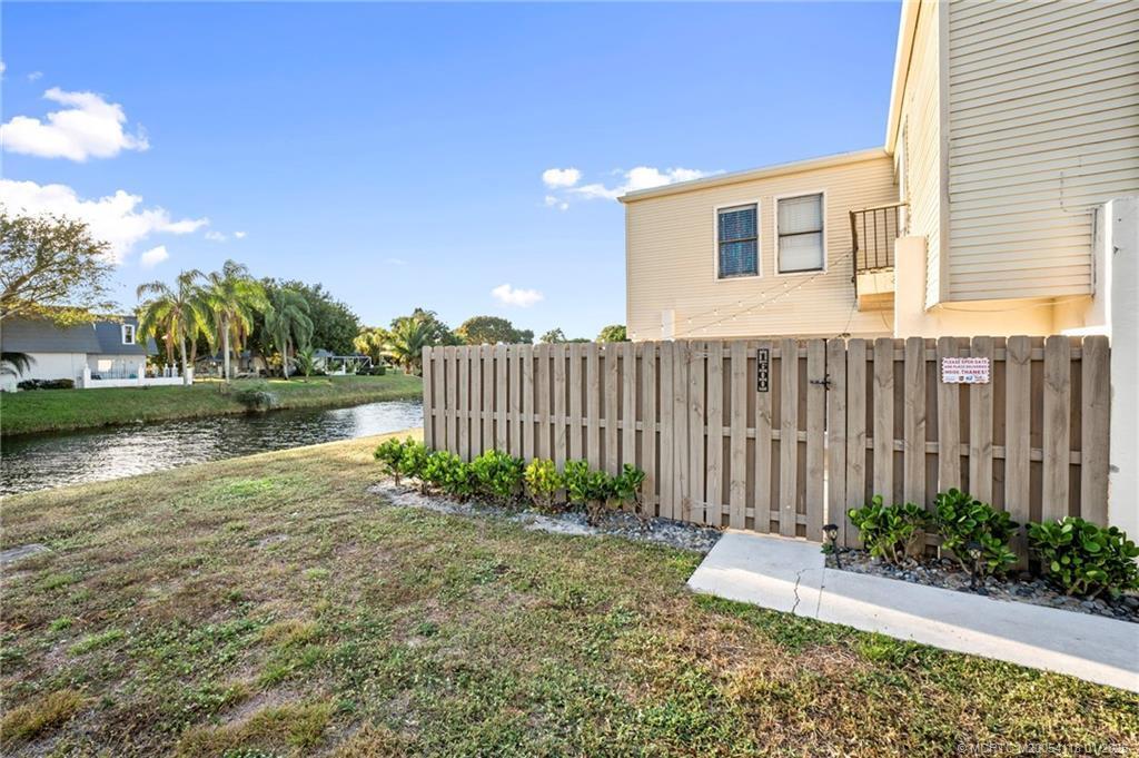 Beautiful waterfront townhome in the heart of Wellington, located in the highly sought-after French Quarter community. This updated 3-bedroom, 2.5-bath residence features a private, fenced, oversized patio ideal for outdoor living and entertaining. The spacious primary suite offers a balcony with tranquil water views. Interior updates include remodeled kitchen and baths, updated flooring, a new roof (July 2025), and newer A/C (March 2020). Enjoy mature trees, sidewalks, and an established neighborhood feel, all just minutes to parks, shopping, schools, and world-class polo and equestrian venues. Nearby amenities include Village of Wellington parks and trails, Aquatics Complex, Amphitheater, Mall at Wellington Green, plus abundant dining and retail options.