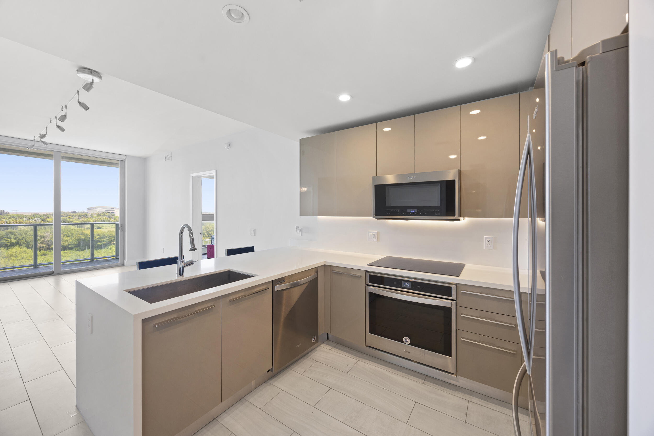 Exclusive 2-bedroom, 2-bathroom residence in Metropica. This open-concept, split-bedroom floor plan seamlessly connects the kitchen, living, and dining areas to aspacious balcony with magnificent views. The residence features sleek modern finishes, a contemporary kitchen with high-end cabinetry and flooring, impact windows, high ceilings, and abundant natural light throughout. Custom finishes enhance the stylish and comfortable living space, and a large washer and dryer. High-speed internet, cable, and water are included in the HOA payment. Enjoy 5-star, resort-style amenities including a stunning pool deck, cabanas, state-of-the-art fitness center, spa, tennis courts, business center, lounge, and more. Just steps from Sawgrass Mills, restaurants, entertainment, and Amerant Bank Arena,