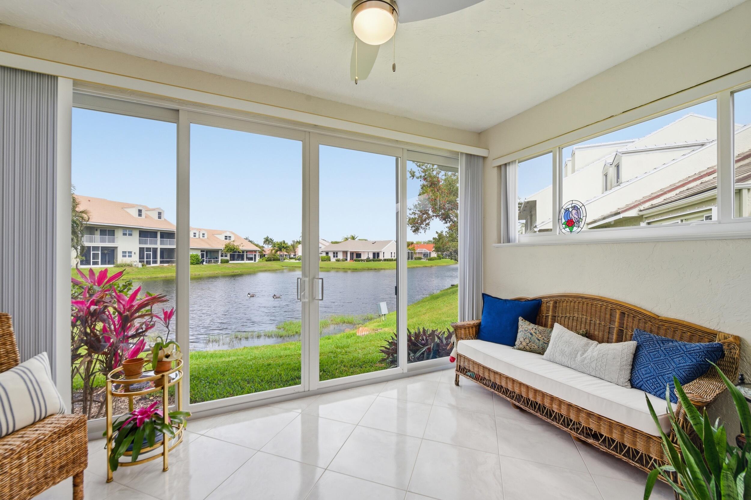 Immaculately maintained + bright, this airy 2/2 waterfront villa with attached 1 car garage offers relaxing lake views while being steps from the Intracoastal Waterway. This spacious end unit has hurricane impact windows + sliders, fully renovated kitchen, double glass doors, porcelain tile throughout,+  a new roof as well as soaring vaulted ceilings + a split floor plan, The upgraded kitchen has a skylight, is bright and inviting. Enjoy the water views from your backyard patio or relax and garden in your front, pavered and gated patio.Located in a pet-friendly, gated community, you'll love the lush tropical landscaping, a heated pool, hot tub, gazebo, and tennis/pickleball courts. HOA includes WiFi, cable, gym, clubhouse, pool, all exterior maintenance and more! (cont.) The Lakeshore community features a direct Intracoastal waterfront community pool and hot tub, where you can relax and watch the yachts and boats cruise by. The community also offers tennis courts, shuffleboard, pickleball, and a clubhouse with a library and fitness center.  Located in the charming town of Hypoluxo, this home offers the perfect blend of tranquility and convenience. You'll be just a short drive away from pristine beaches, world-class dining, upscale shopping, and a variety of cultural attractions.  Don't miss this incredible opportunity to embrace the relaxed lifestyle in the Lakeshore community. This property is perfect for those seeking a peaceful and active lifestyle in a stunning water view setting. Schedule your private showing today and discover the magic! Your retreat awaits!  Pool, hot tub and gazebo are right on the water and a expansive private beach along the intracoastal. Tons of amenities including clubhouse, tennis, pickle ball, gym. Location cannot be beat just minutes to the beach, near I95, Palm Beach International Airport, Delray Beach & West Palm Beach. Pet friendly. Rarely available end unit villa on dead end street.