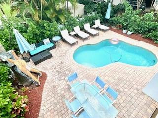 Furniture Negotiable. Can AIrbnb. Luxury Corner Townhouse with Private Elevator, Pool & Spa. Experience the scale and privacy of a single-family home in this expansive, modern corner townhouse. Spanning three light-filled levels, this rare residence is located in the heart of Victoria Park, Fort Lauderdale's premier neighborhood. Offering a private elevator and a resort-style backyard, this home is the definition of effortless luxury. The Ultimate Private Oasis Unlike standard townhomes, this property features an extensive outdoor entertaining space: Private Heated Pool & 7-Person Spa: Featuring customizable LED colored lighting for the perfect evening ambiance. Expansive Pool Deck: A massive sun-drenched area equipped with loungers and dining tables—ideal for the South Florida lifestyle.