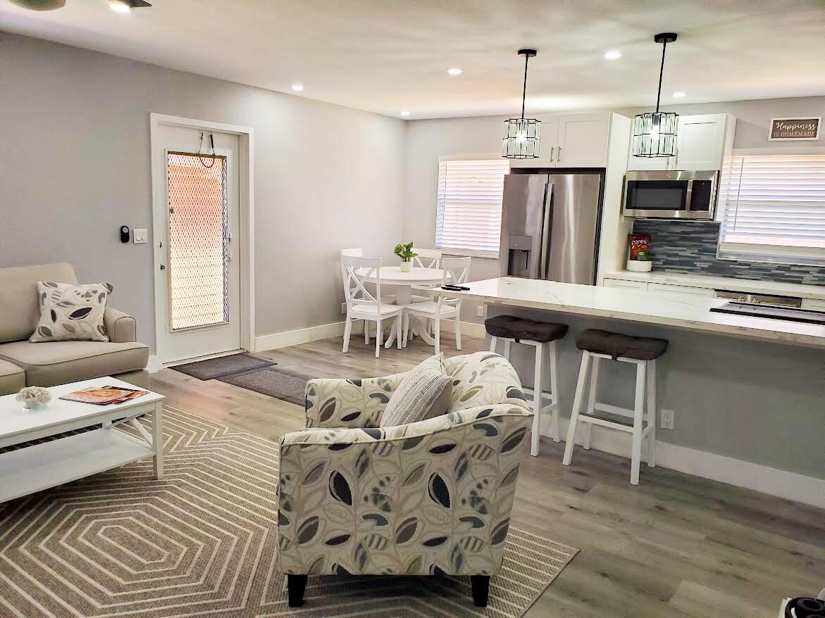Welcome to this charming two-bedroom, two-bathroom condominium nestled in Kings Point Saxony Condos. This 2nd floor condo is totally renovated & updated with white cabinetry, new appliances & modern furnishings & comes with three T.V's & is located steps to the lift. Both baths are updated and the shower in the 2nd bath has glass shower doors. Move in ready, just bring your toothebrush. Enjoy your enclosed patio & convenient full sized washer & dryer. Located within  Kings Point, a 55 plus, gated community with a wide range of activities including golf, indoor & outdoor pools, tennis, pickleball, Broadway style theater, arts & crafts room, billards & much more. Take the buses to shopping. Non-smokers & no pets please. All personal items will be removed prior to new tenant move in.