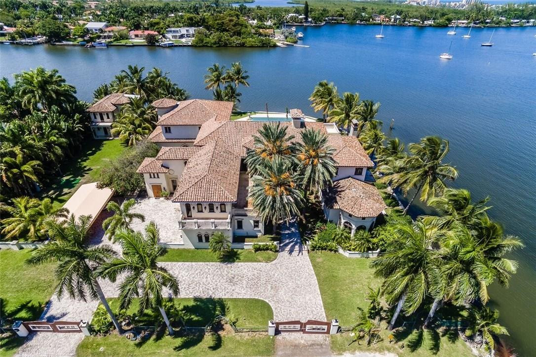 Back on market!  Best Point Lot Waterfront property available in South Florida.  Sensational views of 450 ft of Intracoastal Waterway.  Located on over an acre of land with a home and guest house.  Property is REO and Bank Approved.  Needs work but great investment.  A must see.