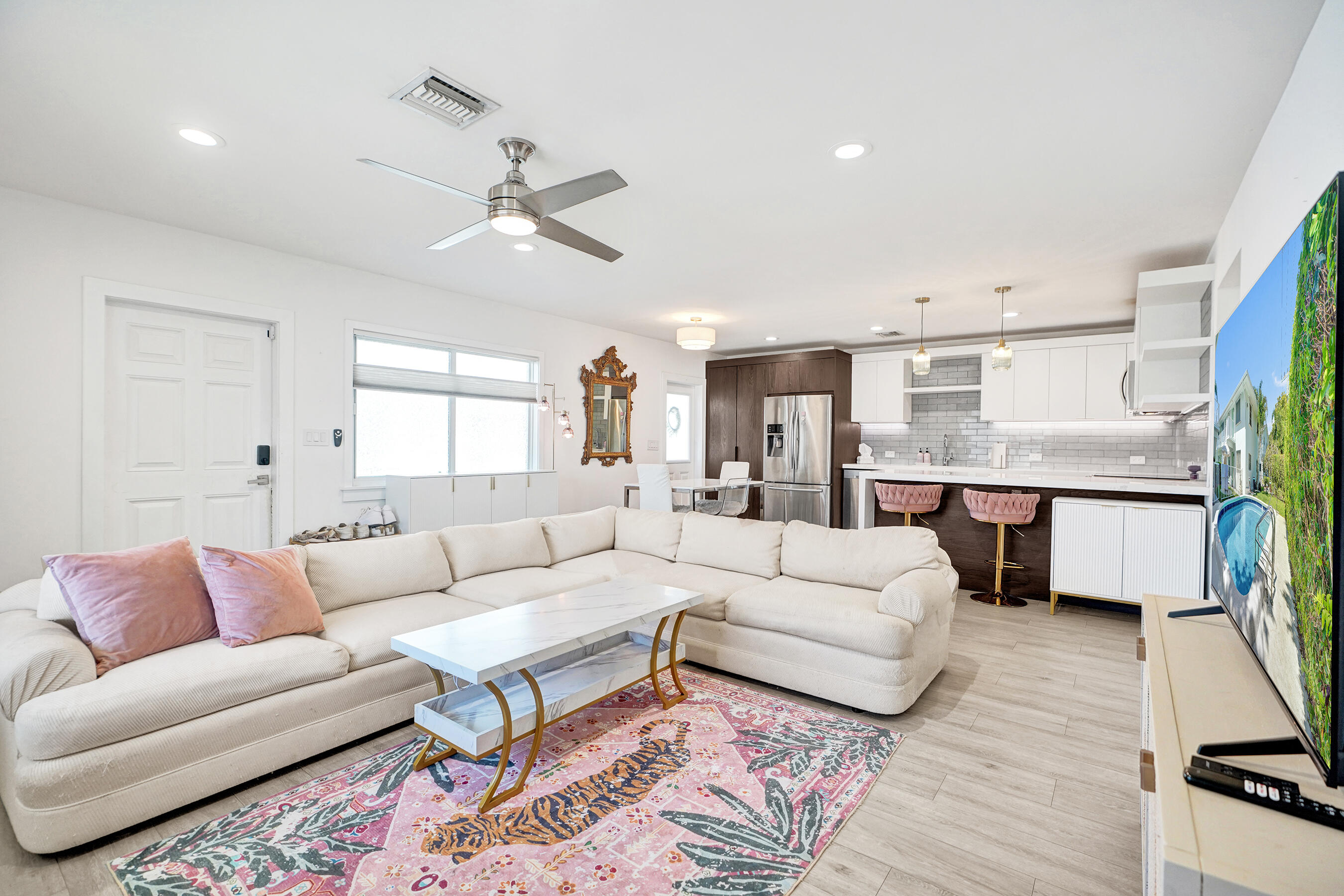 Welcome to the heart of Fort Lauderdale! This beautifully renovated first-floor corner 2-bedroom, 2-bath condo is located in the highly desirable Coral Ridge neighborhood, just east of US-1. Enjoy abundant natural light, a spacious open floor plan, and designer finishes throughout, including impact windows and doors, porcelain plank flooring, quartz countertops, custom closets, and a built-in washer and dryer. Relax by the beautifully landscaped community pool just steps from your door. Centrally located between Oakland Park Boulevard and Commercial Boulevard, just minutes from Lauderdale-by-the-Sea, scenic A1A, and Fort Lauderdale's beautiful beaches. Move-in ready and offering the perfect blend of luxury, privacy, and convenience.