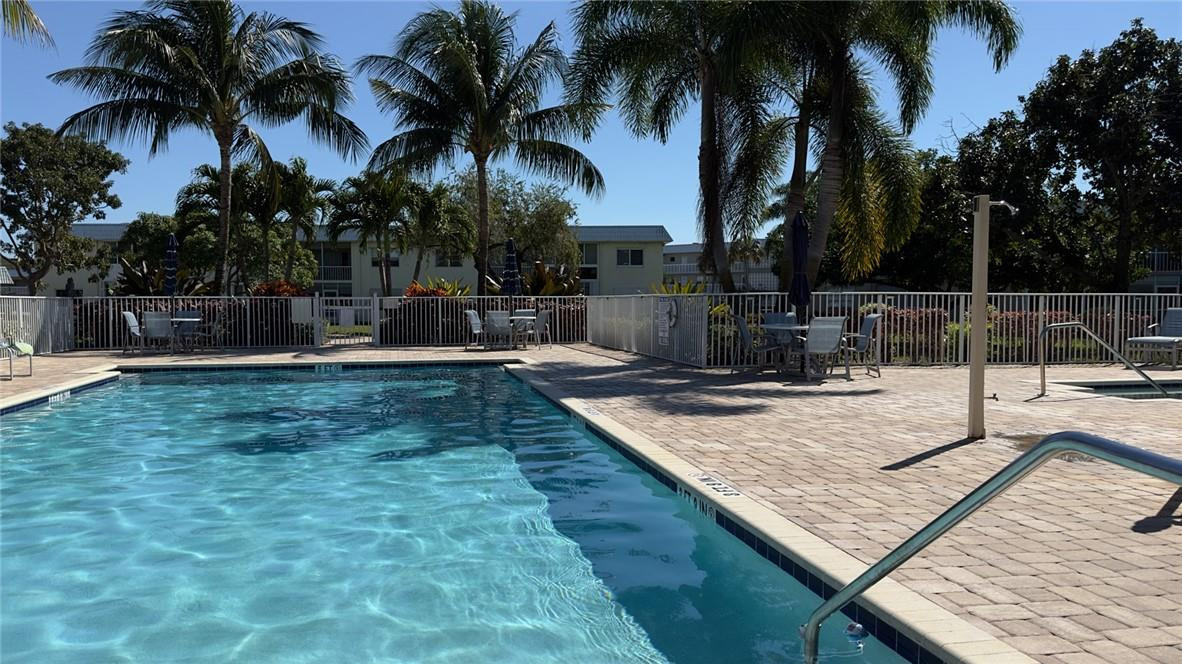Beautiful and extra clean 2 bedroom 2 bathroom condo in a quiet area.  Move in ready!  Enjoy the 3rd-floor views of a lake with mature trees from the screened patio, living areas and master bedroom. Within walking distance of shops, supermarkets, and restaurants. Move-in ready unit with easy elevator access.  A very clean and well-maintained unit that has been updated.  Porcelain tile throughout. Split bedroom plan with plenty of storage and a walk-in closet in the master. New impact front door with window. This is a very well-kept and financially sound 55+ community with a heated community pool and spa in a beautifully landscaped setting.  Easy and convenient access to major highways. Storage locker and laundry facilities on-site.  A must-see!  FULLY FUNDED​​‌​​​​‌​‌​​​‌‌​​​‌‌‌​​‌​​‌‌​​​​ RESERVES.