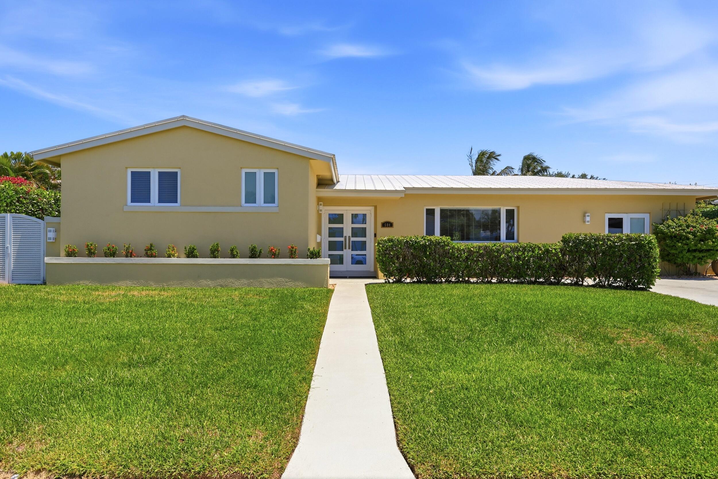 Stunning move-in-ready coastal retreat just minutes from the beach! This beautifully updated 3-bedroom, 3-bath home offers 2,066 sq. ft. under air and 2,660 total sq. ft. under roof, featuring a renovated kitchen, stylishly updated baths, custom doors, impact glass, a metal roof, and a whole-house Generac generator.  The spacious layout includes a breezeway addition, creating exceptional indoor-outdoor living. Enjoy the covered patio with hurricane-rated shades and plumbing in place for an outdoor kitchen and future pool.  Located just steps from NPB Elementary  & Conservatory Shool and two blocks from Anchorage Park, with shopping, dining, and waterfront activities nearby. No HOA. A rare opportunity to own a turnkey home in one of the area's most desirable locations. Nat Gas Is Available
