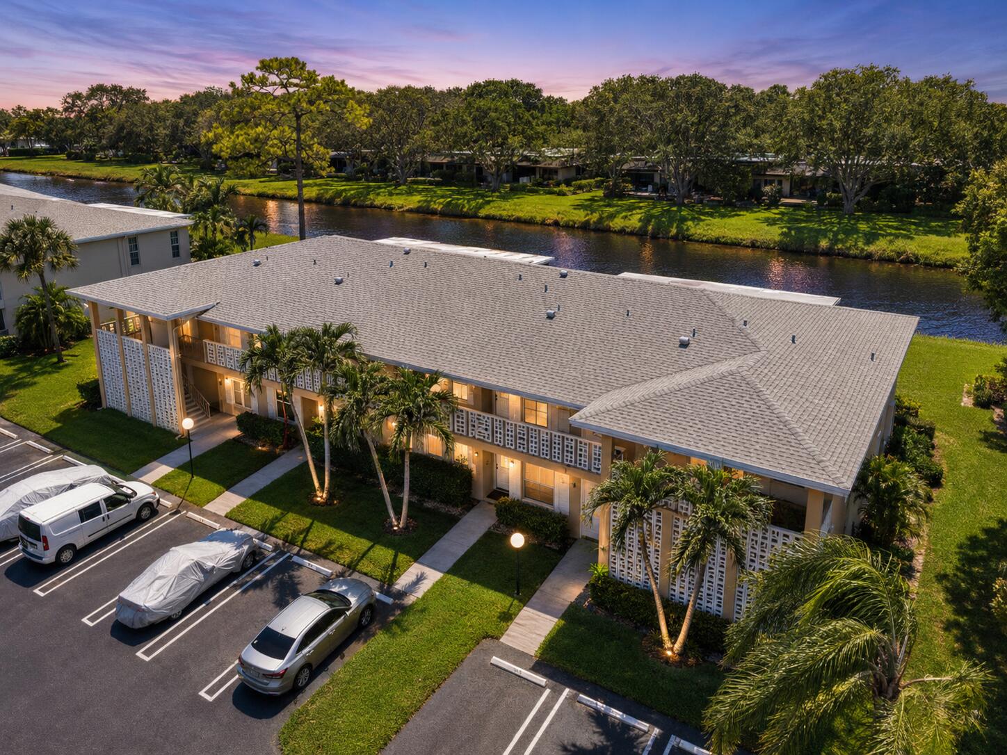 Welcome to Pines of Delray, a highly desirable 55+ community just minutes from Delray's beautiful beaches and vibrant Atlantic Avenue, known for its restaurants, shopping, entertainment, and exciting day and nightlife.  This move-in-ready 2-bedroom, 2-bath waterfront condo features a bright open layout, oversized living room, and peaceful water views from both the living room and primary bedroom—perfect for enjoying your morning coffee.  Recent updates include a 2022 A/C, impact windows, accordion shutters, upgraded electrical panel, new dishwasher, updated bathroom tile, and in-unit washer and dryer. Neutral diagonal tile flooring runs throughout the home. Sold fully furnished (furniture can be removed if desired), making this the perfect seasonal getaway or year-round residence.  Billiard Room; Bocce Ball; Clubhouse; Community Room; Fitness Center; Game Room; Hot Water; Internet Included; Maintenance; Parking; Picnic Area; Pool; Recreation Facilities; Sauna; Shuffleboard Court; Sidewalks; Street Lights; Other