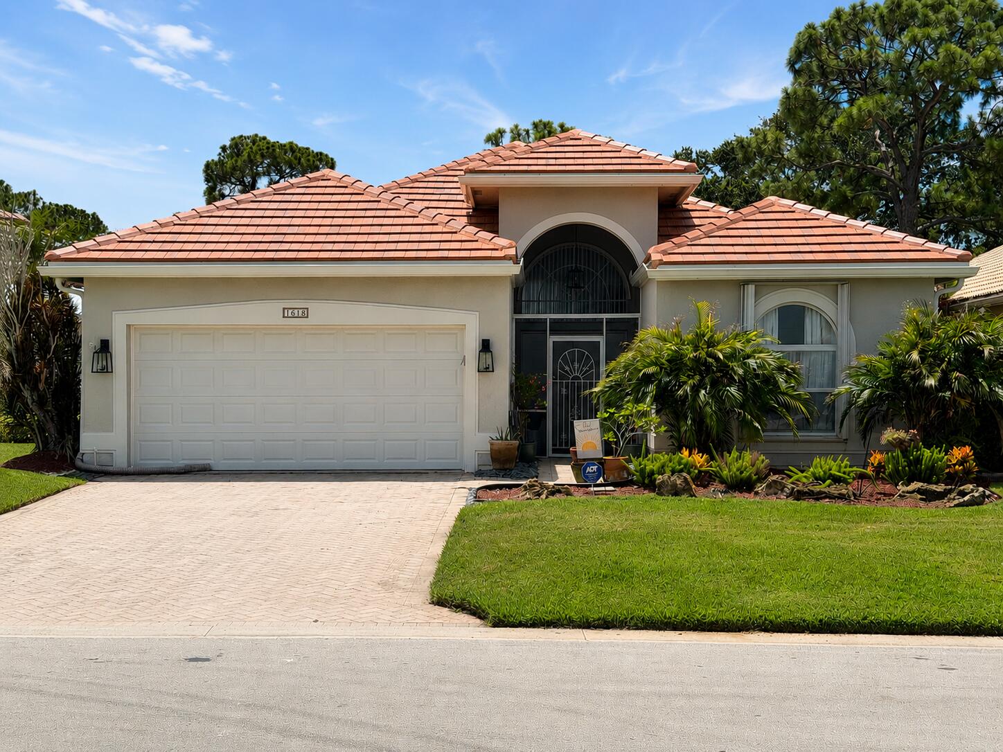 Meticulously maintained and beautifully presented, this 3-bedroom, 2-bath home is move-in ready and shows like a model. Filled with natural light, it features a spacious 2-car garage and a screened lanai overlooking the backyard and golf course.  Enjoy peace of mind with major updates including a new roof and gutters with transferable warranty ('25), impact windows and shutters ('24), impact-rated garage door ('25), A/C ('23), interior paint, kitchen and laundry appliances, and carpeting ('22), plus refreshed landscaping and an ADT security system.  Located in the sought-after gated community of Ballantrae, residents enjoy a manned gate, a Jack Nicklaus Signature Golf Course with optional memberships, and a 67-slip marina with slips available for purchase. Just minutes from the Treasure Coast Mall, beaches, dining, and medical facilities, this home truly offers the best of the Florida lifestyle.