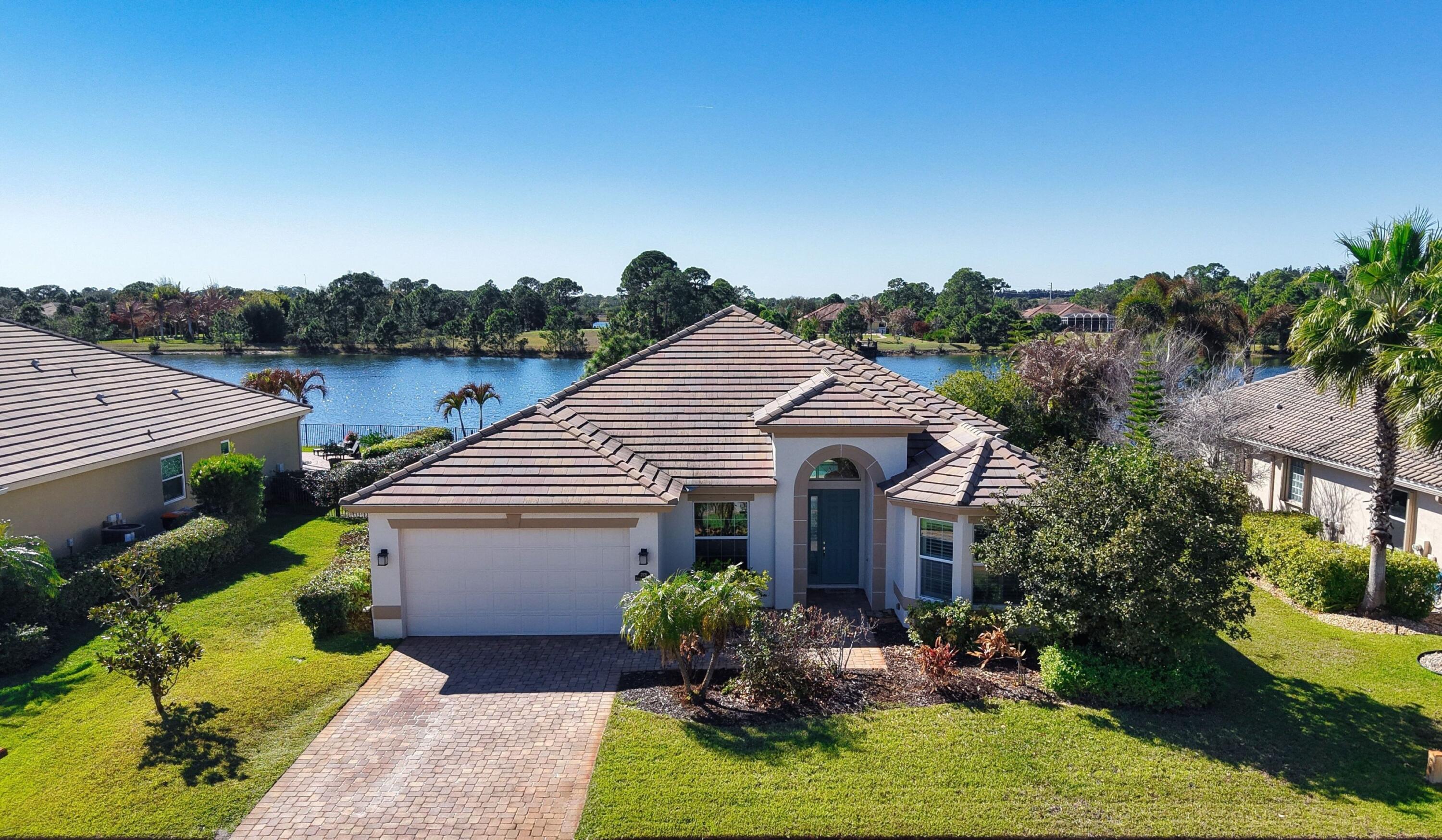Waterfront pool home in Fieldstone Ranch! This spacious CBS home offers 3 bedrooms, 2 baths, plus a den ideal for a home office or 4th bedroom. The gourmet kitchen features custom cabinetry, granite countertops, double ovens, pantry, and a breakfast area overlooking the lake. The primary suite includes large walk-in closets and an expansive bath with soaking tub & separate shower. Additional highlights offer 12ft ceilings, wine bar, plantation shutters, oversized 2-car garage, & large laundry room with utility sink. Enjoy Florida living with a private pool with fountains, & serene lake views.