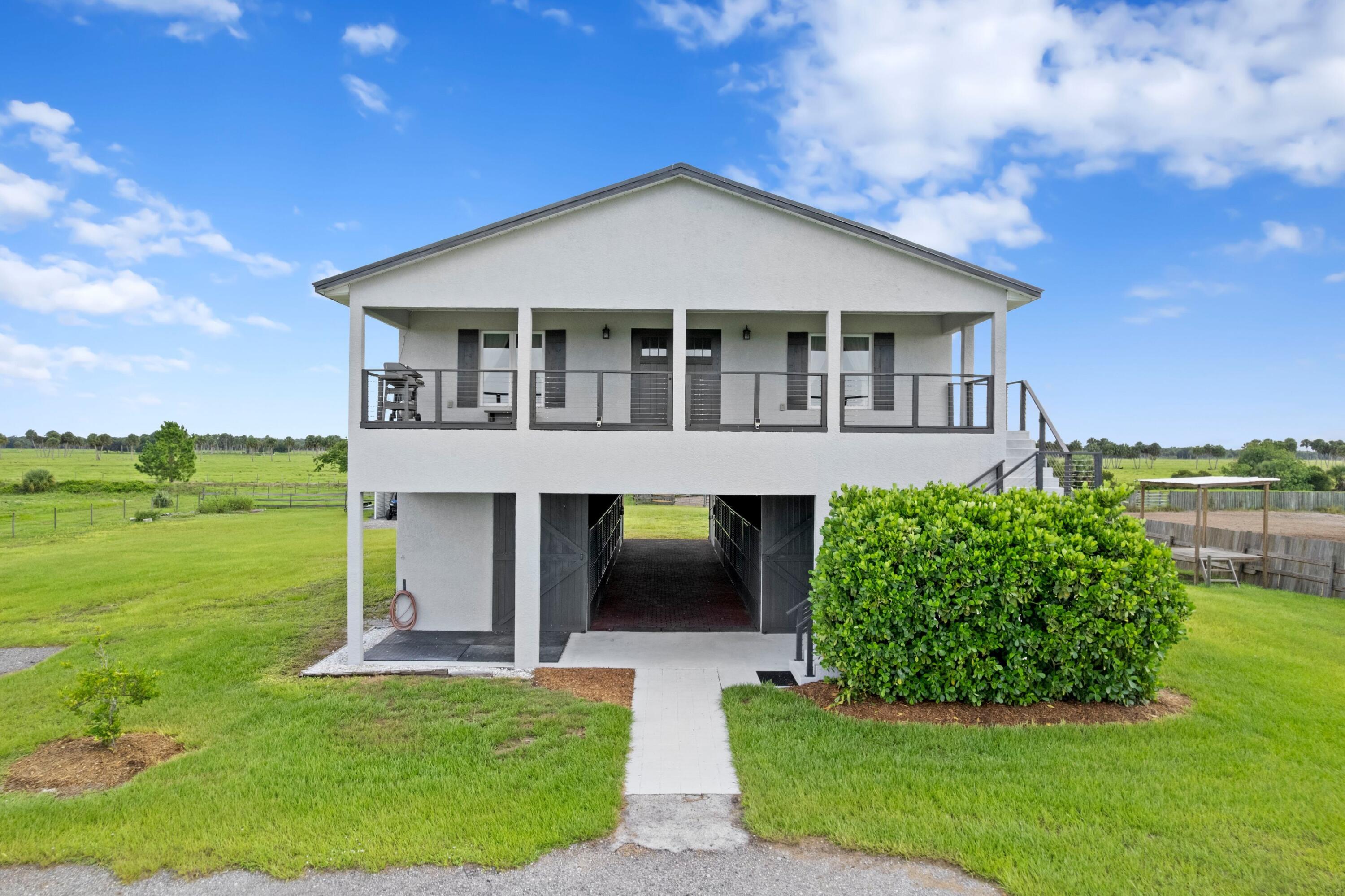 Stunning equestrian facility in the gated community of Sherman Wood Ranches on 8.65 fully fenced acres. Features a custom 8-stall barn with A/C tack room, feed room, auto fly system, wash bay, and half bath. Includes a 140' x 225' arena, round pen, and community bridle trails. The 3BR/2.5BA home offers modern farmhouse living with panoramic sunrise and sunset views, and a backyard reminiscent of Yellowstone with wide-open pasture views. 40' x 30' metal shop/garage, perfect for equipment or storage. Ideal for anyone wanting peace and purpose, workers, Airbnb use, private retreats, or horse rehab. Minutes to Publix, Home Depot, and downtown shops. Right in between Ocala and Wellington International. This is a turnkey fully furnished amazing opportunity! Recent appraisal attached.