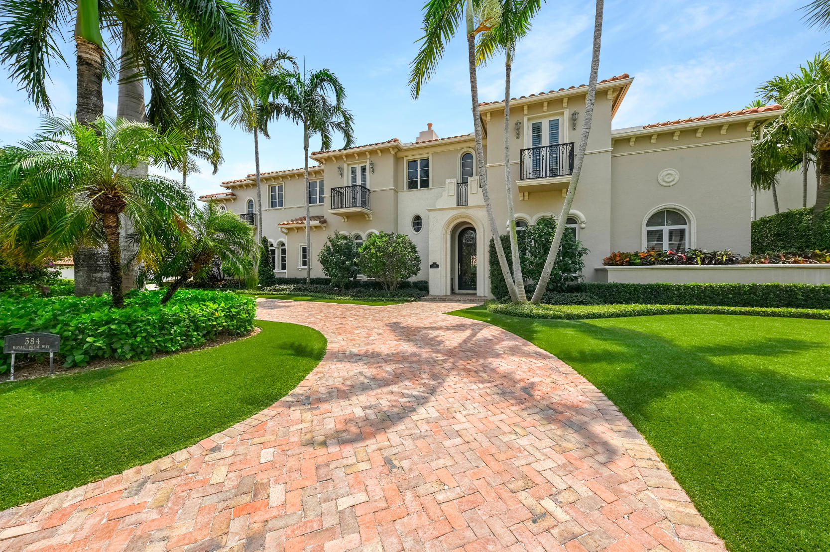 SITED ON TWO LOTS  with a beautiful garden, this exquisite 2-story 7 bedroom estate presents the epitome of gracious living.  The first floor offers a formal living room, handsome mahogany library/office, elegant  dining room, family room adjacent to the large chef's  kitchen, front and back staircases, 2 half baths,  and a spacious master suite enjoying garden and pool vistas.  The 2nd floor offers a large loft and 6 ensuite bedrooms.  The heated pool and spa look to the magnificent garden and greenery.  Side-loading air-conditioned garage, impact glass,  full-house generator  are some of the many special features of this distinguished residence located in the prestigious and sought after community of Royal Palm Yacht & Country Club.