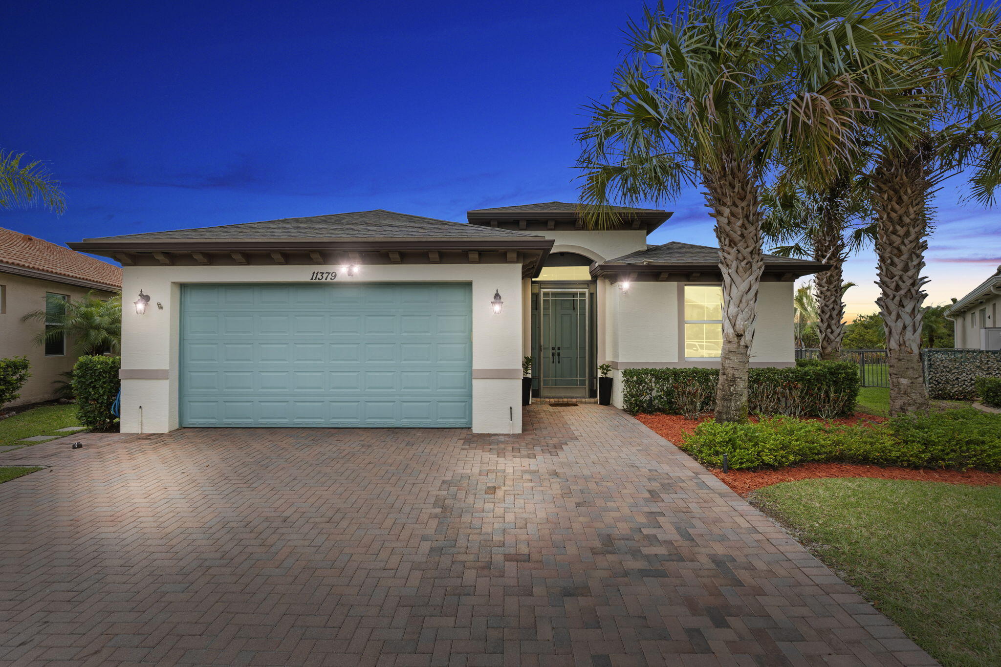 There are homes that check the boxes, and then there are homes that make you feel something the moment you walk in. This is one of those homes.  Set within TownPark at Tradition, this upgraded residence feels like it was pulled straight from your favorite design board, reimagined with intention, style, and a level of care that is immediately evident.  The split floor plan offers privacy where you want it and openness where you need it, all wrapped in a light-filled interior that feels calm, clean, and effortlessly put together.  The kitchen has been thoughtfully renovated and expanded, featuring refurbished and extended cabinetry, updated countertops, a fresh backsplash, and newer appliances. It is the kind of space that invites both everyday living and hosting without missing a beat. Just beyond, the living areas flow naturally, grounded by brand new vinyl flooring that runs seamlessly throughout the home. A custom indoor bar creates a standout moment and sets the tone for entertaining, while the additional flex space currently styled as a playroom can easily transition into a formal dining area, second living room, or home office depending on your needs. Each bedroom has been elevated with custom built-in walk-in closets, and the second en-suite offers a comfortable and private retreat for guests or extended family.  Step outside and the experience continues. A covered and screened patio opens to a fully equipped outdoor kitchen, creating a true extension of the home. The backyard is spacious, fenced, and private, backing to a preserve with no rear neighbors, giving you a quiet, uninterrupted view that is hard to find. Full impact glass provides peace of mind, while the overall condition of the home reflects pride of ownership at every turn.  Living in TownPark at Tradition means access to a lifestyle that feels like a resort, complete with a clubhouse, resort-style pool, splash park, fitness center, and sports courts, all just minutes from shopping, dining, and easy access to I 95.  This is not just an upgrade from its last purchase. It is a complete transformation into something far more refined, far more intentional, and ready for someone who will appreciate the difference.