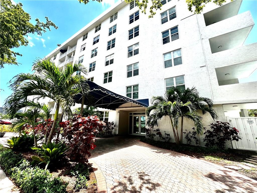 This is a rarely available, ALL AGES 2/2 condo in a cozy hi-rise 8-story building right on US1-Federal Highway. Largest Corner Unit (B stack). Walking distance to everything, shops, gyms, restaurants, banks, & Pine Crest School. This South facing unit has a balcony with direct view of the pool, granite vanity countertops, open kitchen with custom cabinets, all impact windows & sliding doors.  Building is secured with keys & callbox access only. Brand new elevators are scheduled to be installed anytime.  Building has completed 40 year inspection in 2020 & has NO pending assessment currently. Building has interior stairways - no Catwalks.  Amenities include Pool, herb garden, bike room, Community rm with weekly PingPong nights & Car Wash area. FIRPTA Seller. No Rental.