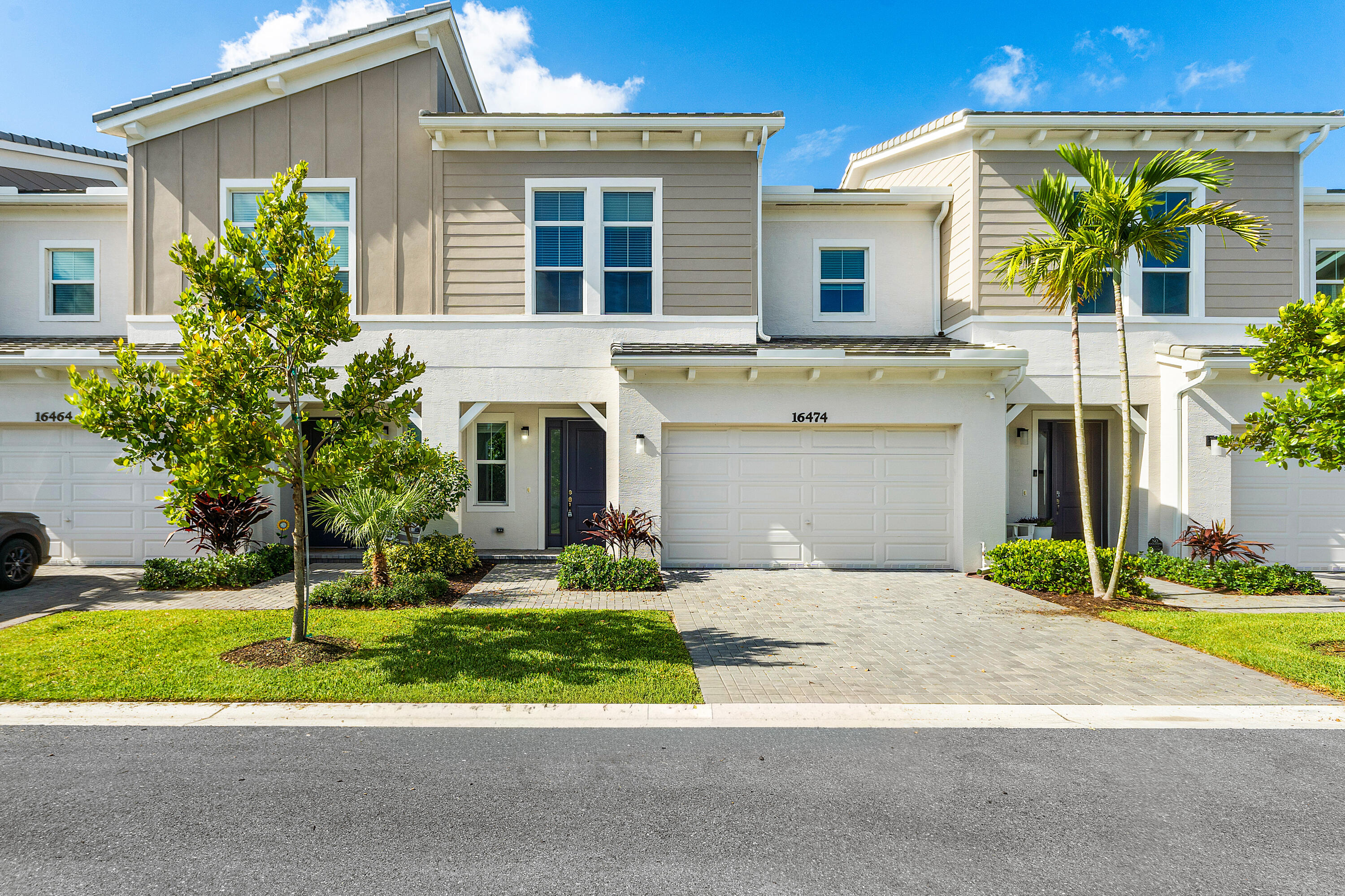 Experience resort-style living in the award-winning city of Westlake! This beautifully maintained newer-construction Biscayne model townhome offers 3 bedrooms, 2.5 bathrooms, a 2-car garage, and over 2,100 square feet of thoughtfully designed living space. The open-concept floor plan features spacious living and dining areas, upgraded flooring, impact windows and doors, designer cabinetry, quartz countertops, stainless steel appliances, and abundant natural light throughout. The well-appointed kitchen opens seamlessly to the great room, creating the perfect space for everyday living and entertaining. Upstairs, the generous primary suite offers a private retreat complete with a large walk-in closet and spa-inspired bath. Two additional bedrooms provide flexibility for family, guests, or a  home office. Enjoy outdoor living on the covered patio and private backyard area. Located in The Crossings at Westlake, residents enjoy access to Adventure Park featuring a resort-style lagoon pool, splash pad, waterslide, BMX pump track, basketball courts, playgrounds, dog park, event lawn, and miles of scenic walking and biking trails. Conveniently located near shopping, dining, top-rated schools, major highways, Palm Beach International Airport, and area beaches. Available for immediate occupancy. Don't miss this opportunity to enjoy one of Palm Beach County's premier lifestyle communities.