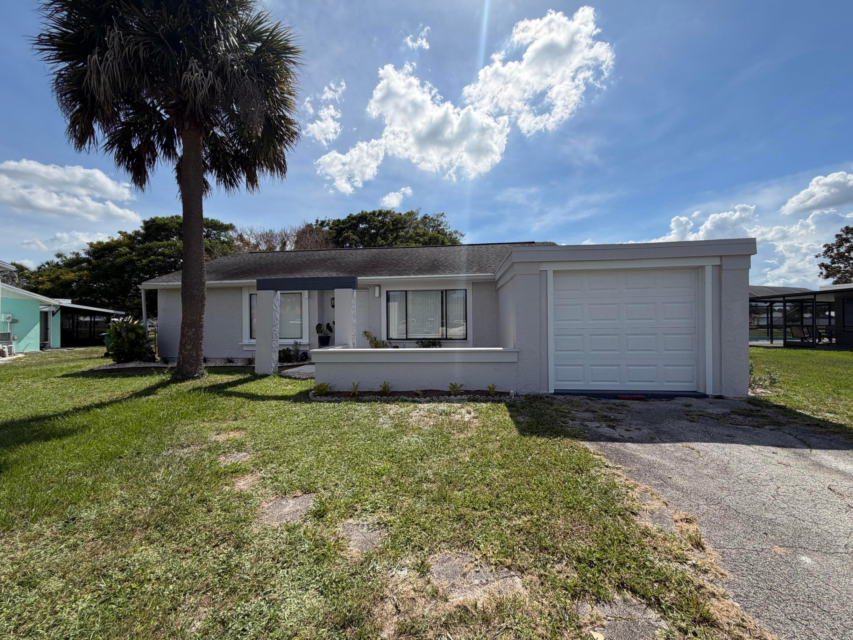 Welcome to your cozy retreat! This charming home features 2 bedrooms, 2 baths, and one car garage.Enjoy the spacious kitchen and a lovely covered patio, perfect for entertaining while taking in stunning lake views. With tile flooring throughout and fresh paint, this home Is move-in ready. The large backyard offers ample space for outdoor activities.Don't miss out this opportunity!