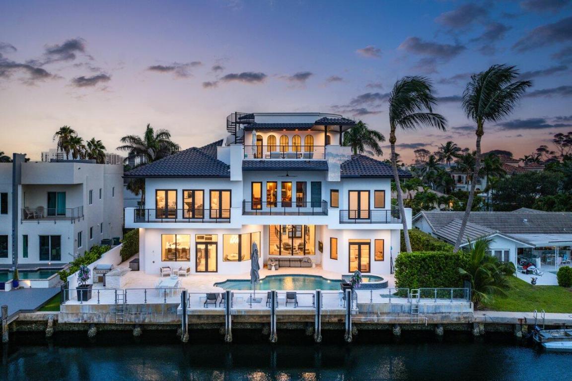 A Luxurious Waterfront Masterpiece in Highland Beach

Discover this impeccably upgraded sanctuary on the coveted barrier island of Highland Beach. Nestled at the wide mouth of the Bay, this extraordinary residence offers breathtaking panoramic views and exclusive private gated beach access.

As the tallest home permitted in the area, it boasts unparalleled 360-degree vistas of the Intracoastal Waterway, ocean, and city skyline. This architectural marvel features soaring ceilings, five spacious en-suite bedrooms, a private office, six full baths, and two half baths. An elevator provides seamless access to all levels, while a private theater room, fireplaces in the living room and master suite, and dual laundry rooms (upstairs and downstairs) elevate everyday luxury. Crafted with meticulous attention to detail, the home is equipped with impact windows and doors, a three-car garage, and an array of thoughtful upgrades, including a full-house generator, state-of-the-art smart home system, and a spectacular outdoor kitchen. The top floor includes a second entertainment space with sprawling views, fire pit, and room for plentiful seating.The expansive patio, inviting pool, concrete dock, and seawall make outdoor living a dream.

This home is the ultimate expression of refined elegance and modern convenience, perfect for those seeking a waterfront retreat with every imaginable amenity.