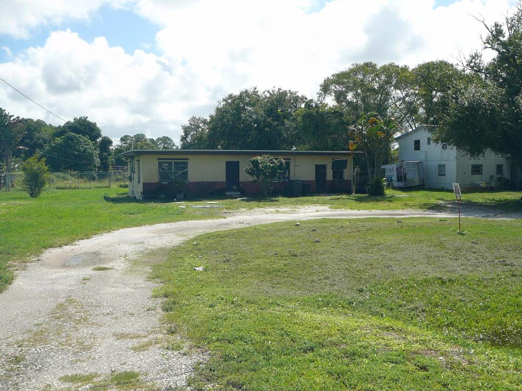 OWNER FINANCING ONLY ON THIS OUTSTANDING INDUSTRIAL BUSINESS OPPORTUNITY! .94 ACRES WITH TWO ROAD FRONTAGES AND A 1200 SF HOME WITH A SEPARATE GARAGE PERFECT FOR AN OFFICE AND STORAGE. RETENTION POND ON SITE, HOWEVER MAY BE FILLED IN FOR MORE USEABLE SPACE. DIRT ON SITE TO FACILITATE THE FILL. CONCRETE BLOCK HOME HAS NEWER ROOF AND GREAT BONES, 3 BEDROOMS AND 1 BATHROOM AND KITCHEN. 100 FEET FRONTS METZGER ROAD AND APPROXIMATELY 60 FEET FRONTS NORTH 44TH STREET, EASY ACCESS FOR VEHICLE AND MACHINERY STORAGE. INDUSTRIAL PARCELS LIKE THIS DO NOT COME ALONG TOO OFTEN AND GO FAST. PROPERTY MUST BE PURCHASED BY OWNER FINANCING. $100,000 DOWN, THE $225,000 AMORTIZED FOR 8 YEARS AT 6%. PAYMENT WILL BE $2,957 PER MONTH.  EASY TO SHOW, SO SEE IT TODAY.