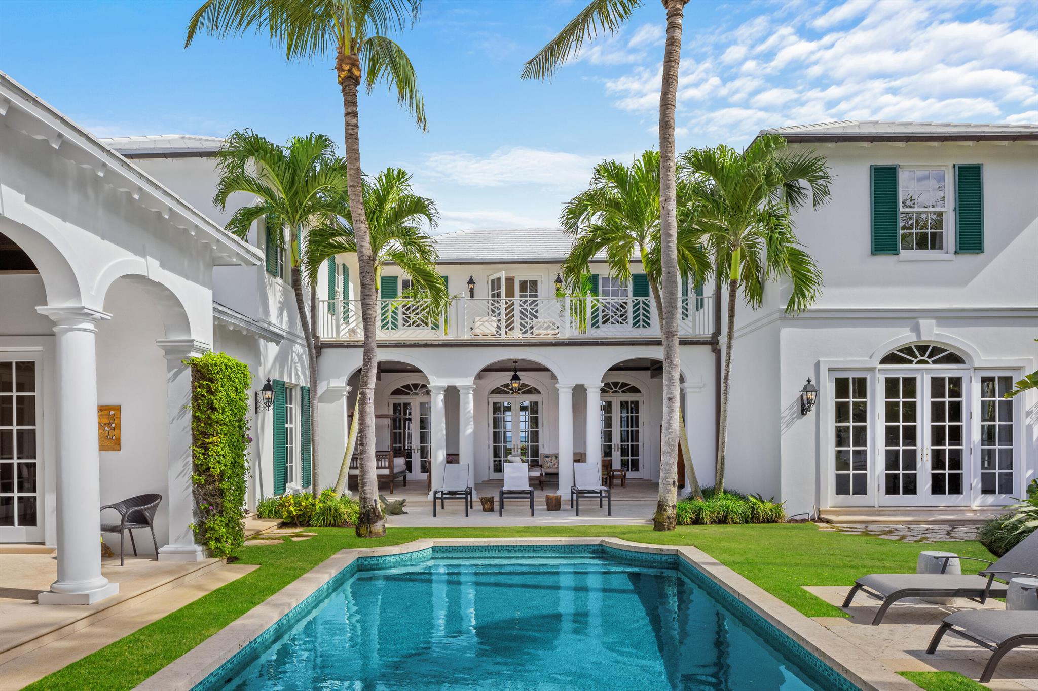 Welcome to this move-in ready estate that sits directly on the beaches of exclusive Jupiter Island. A true turnkey luxury retreat that offers immediate peace of mind. This beautiful 5 bed, 7.5 bath home enjoys a 16' elevation, is located on 1.52 acres with 136 feet of private beachfront. The newer (2007) home is 7,597 square feet and perfectly situated for those seeking the idyllic lifestyle.  Designed by renowned architect, Thomas Kirchhoff the home has a private island, richly appointed aesthetic, with high ceilings and Brazilian walnut floors throughout.  The first floor has floor to ceiling French doors with an expansive living room having breathtaking ocean views, a custom office with beautiful cypress walls and built-ins, two dining rooms a guest bedroom and private bath. A separate family room is perfect for those indoor gatherings, overlooking the picturesque pool and private gardens.  The ultimate chef's kitchen features a Wolf oven, twin Subzeros, two dishwashers, an oversized island and butler pantry, ideal for entertaining.  Additional full and half baths, full laundry room, study nook, hidden wet bar and elevator completes the thoughtfully designed first floor. 
 
Take the private elevator or two separate winding staircases to the second floor with four additional bedrooms, five bathrooms and three large terraces with choice of pool/garden or magnificent ocean views.  The large, private primary suite has vaulted ceilings, his and her custom closets and his and her luxury baths.  There are French doors leading to an oversized balcony to enjoy unobstructed ocean views or to simply feel those evening ocean breezes.  There are three additional bedrooms on the second floor and expansive terraces.   Additional laundry and storage for ideal convenience, complete the second floor.  The home has been meticulously maintained, with a brand new roof (October 2024) and whole house generator (February 2025) and includes an oversized 3-car attached garage.
 
The outdoor beauty of this home is ideal for al fresco dining, from the private gated courtyard with gardens and custom swimming pool and waterfall, to the multiple covered loggias and outdoor kitchen.

Truly an unparalleled opportunity to own a fully furnished beachfront sanctuary!
