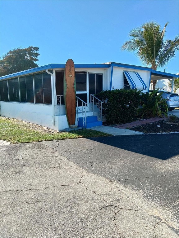 Location. Location. Location. Best location in the Jensen Beach Florida area.  Small park directly on the Intercoastal.  Only 69 homes total.   We own the land.  55+ park . One mile from Jensen Beach village.  3 miles from the ocean.  Only $255 / month HOA. Included water , septic , garage removal and lawn service . Definitely the best in this area.  Free area for motorcycles, boats , rv's , trucks etc. 2 bedroom.  2 bath.  2 lanai's.  2 sheds.  Big car port.  Directly on pond . Needs nothing.  Great condition