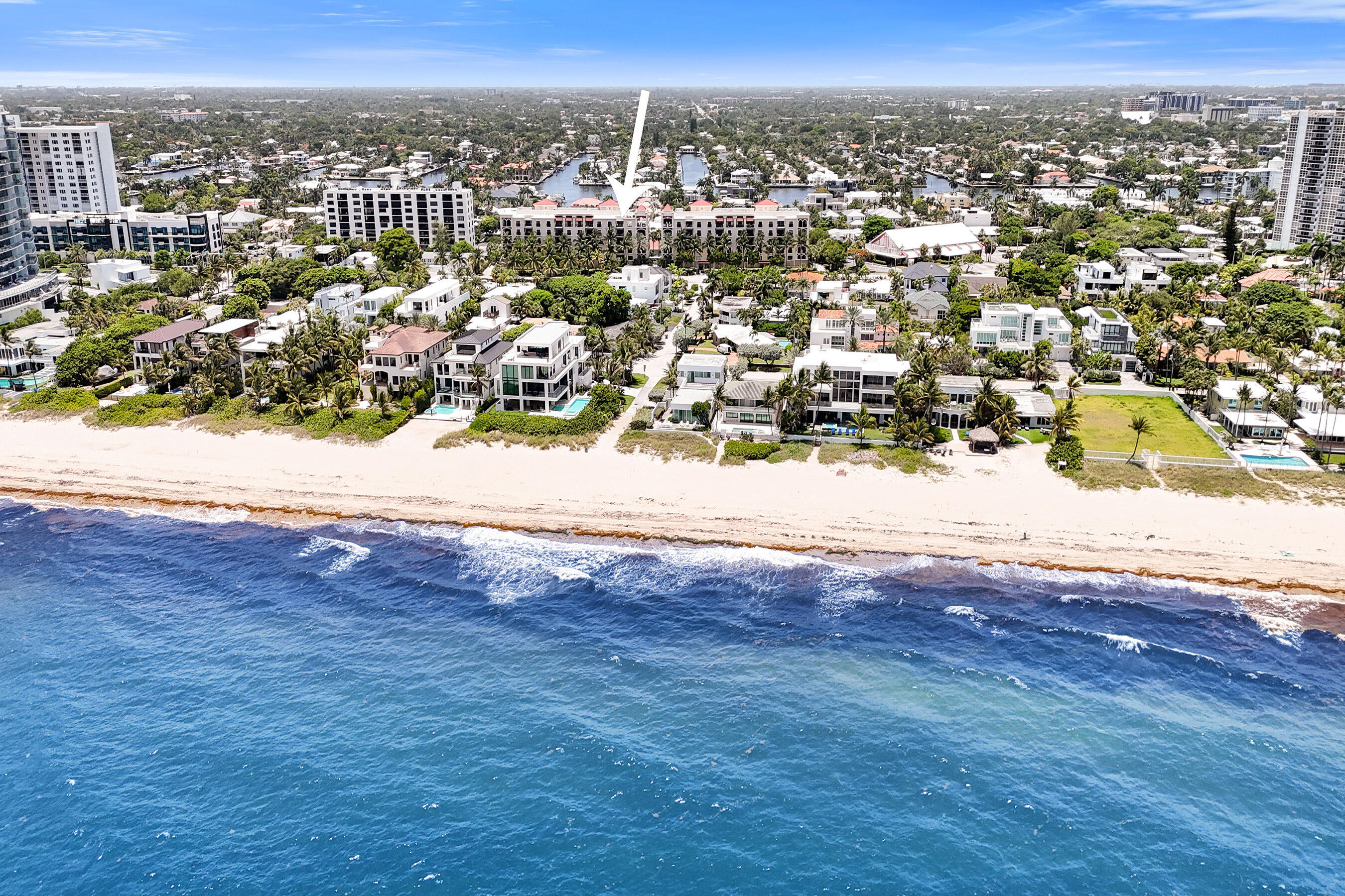 Experience one of the most coveted residences in the exclusive boutique Fountains on Ocean. This is the only 3-bedroom, 3-bathroom ensuite corner residence in a beautifully maintained building with just 61 residences and only two units per floor. This spacious split-bedroom floor plan offers exceptional privacy and breathtaking unobstructed ocean views from nearly every room, complemented by two expansive balconies perfect for enjoying the coastal breeze. The open-concept living and dining areas flow seamlessly into a beautifully updated chef's kitchen featuring KitchenAid stainless steel appliances, double convection ovens, granite countertops, custom cherry cabinetry, and elegant marble finishes. Additional highlights include wood flooring throughout, impact windows and doors, smart  homelighting, Hunter Douglas remote window coverings throughout, surround sound, custom closet systems, abundant storage, and a versatile third bedroom with a custom Murphy bed. The spacious primary suite features a walk-in closet, additional his-and-her closets, and a spa-inspired bath with a Jacuzzi tub—even a smart TV built into the mirror. Residents enjoy exceptional amenities, including a rooftop pool and fitness center, a panoramic ocean and Intracoastal social deck, 24-hour manned security, gated entry, two premium garage parking spaces conveniently located near the elevator, ample guest parking, bike storage, pet-friendly living (two pets permitted), and fully funded reserves. Ideally located directly across from the beach, just a two-minute walk to the sand, and within walking distance of Publix, restaurants, shopping, and everything Fort Lauderdale's coastal lifestyle has to offer. We cannot wait to show you!
