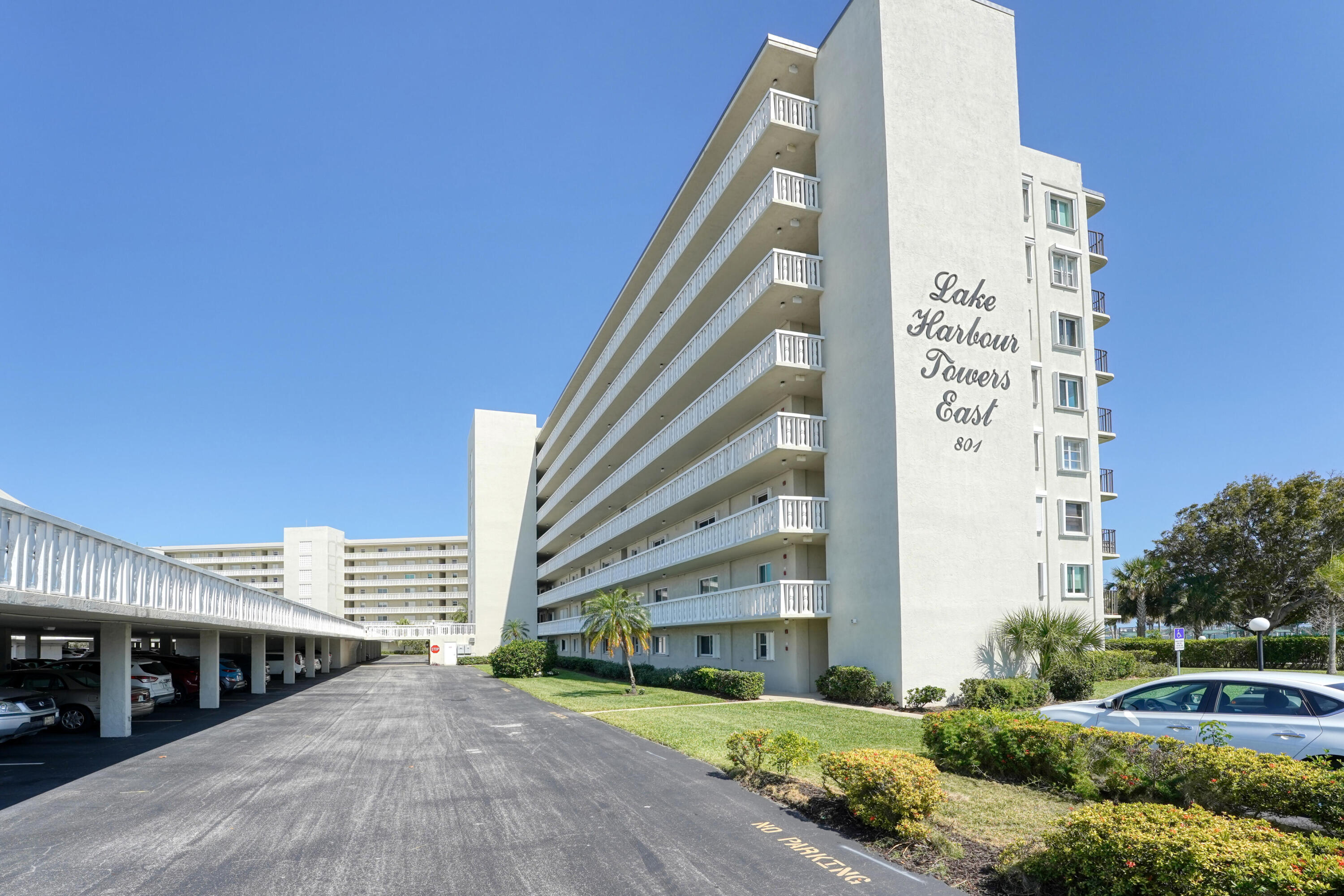 2 bedroom, 2 bathroom Lake Harbour Towers East, waterfront condo situated along the intracoastal waterway.  First floor fully renovated  - highlights include a sleek kitchen featuring quartz countertops and stainless steel appliances, beautiful bathrooms, new water heater, full size washer and dryer, recessed lighting, ceiling fans, new closet and bedroom doors and all new electrical and plumbing.  In a gated community offering security, covered parking, two pools, a barbecue area, community room, putting green and shuffleboard. Kelsey Park is within walking distance, offering Pickleball courts, tennis courts, and scenic walking trails along the intracoastal. LHTE passed the "milestone inspection" required by FL Statute. All room sizes approximate. Turn key unit ready t o move in. Priced to sell!