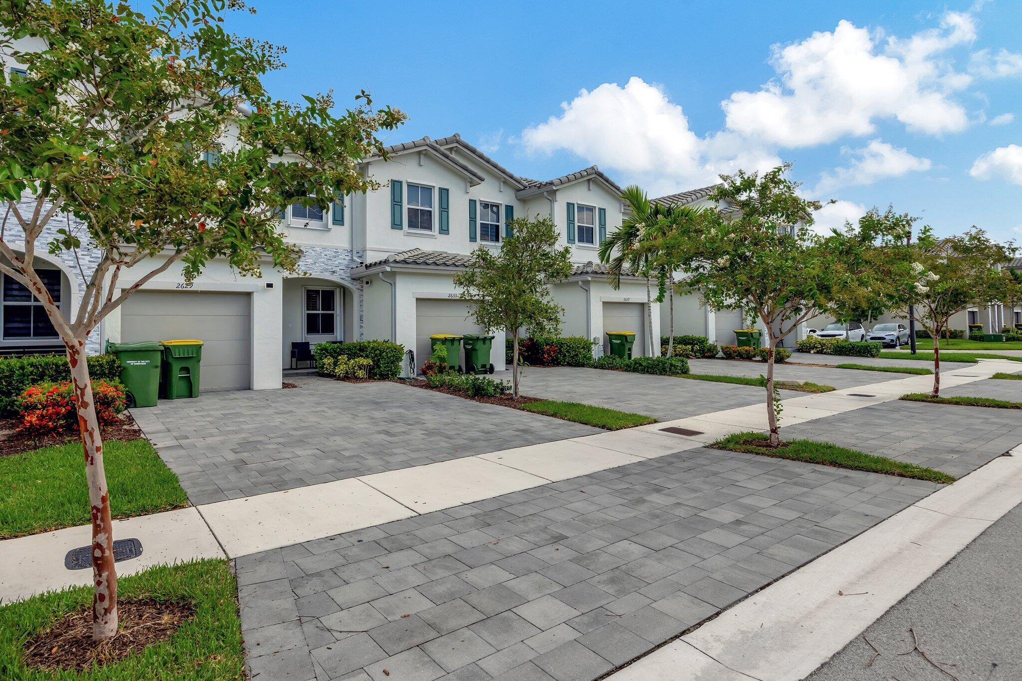 Beautiful & Spacious 3-Bedroom Townhome in Keys Gate. Like-new 2020 townhome located in the desirable community. This meticulously maintained 3-bedroom, 2.5-bathroom home offers a perfect blend of style, comfort, and modern amenities. Open-concept kitchen equipped with sleek stainless steel appliances and an upgraded sink and faucet. The kitchen flows seamlessly into the living area, where natural light floods through custom plantation shutters and a glass patio door, creating a warm and inviting atmosphere. The home boasts tile flooring throughout, adding a touch of elegance, while the one-car garage features durable porcelain tile flooring. For peace of mind during stormy weather, the property is outfitted with accordion storm shutters on all windows.