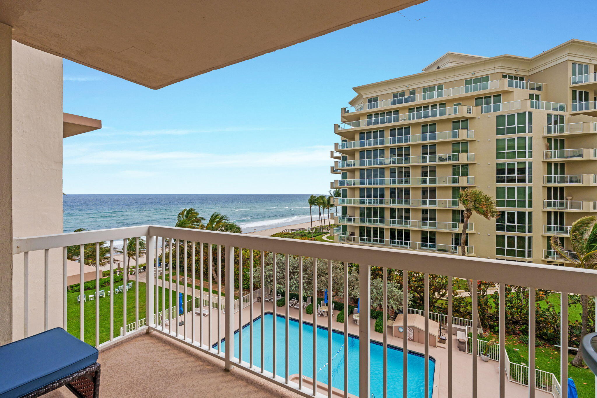 Experience coastal living in this beautifully appointed 5th-floor condo on prestigious Hillsboro Mile. This spacious 2BR/2BA residence offers breathtaking, unobstructed Atlantic Ocean views from a private balcony—perfect for sunrise mornings and ocean breezes. The open layout features a bright living space with floor-to-ceiling impact glass, filling the home with natural light and showcasing panoramic views. The updated kitchen includes modern cabinetry, granite countertops, and stainless-steel appliances. The primary suite offers ocean views, ample closets, and an en-suite bath, while the guest bedroom and second bath provide comfort and privacy. Amenities include private beach access, oceanfront heated pool, clubroom, and secure entry. Ideally located between Boca Rato n and Pompano Beach, you're just minutes from fine dining, shopping, and entertainment. Whether you're seeking a full-time residence or a seasonal escape, this exceptional property delivers the ultimate South Florida beachfront lifestyle.