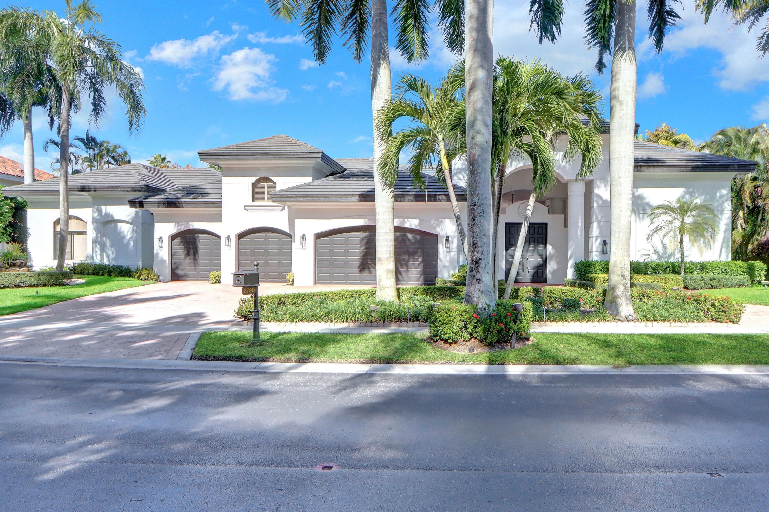 GOLF MEMBERSHIP AVAILABLE!  This elegant one-story courtyard estate of refined living nestled on the golf course features 6 bedrooms, 6½ baths, an office, an 8-seat media room, and a 4-car garage, The exquisite residence is filled with natural light and enhanced by volume ceilings, Saturnia marble floors, wood-grain porcelain tile in the primary suite, hardwood and carpet in the secondary bedrooms. Other features include a remodeled primary bathroom, decorative columns, plantation shutters, 2 laundry rooms, and accordion hurricane shutters. The expansive courtyard is ideal for entertaining with plenty of lounge space, a freeform pool and spa, and an inviting gazebo with a grill and TV. Call today to experience and own this exceptional home!