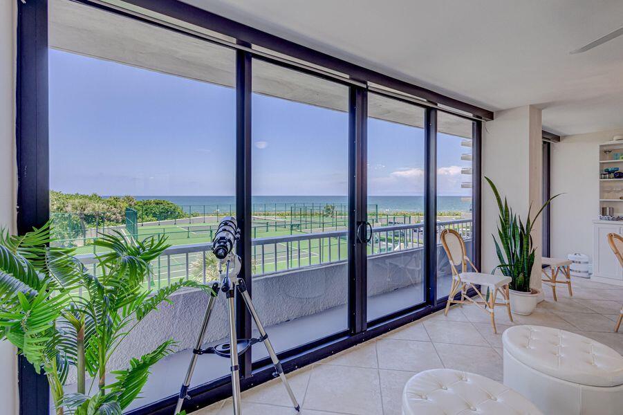 Experience one of Singer Island's most exceptional waterfront residences in the coveted 200 building at Water Glades. Ideally positioned in what many consider the premier stack, Residence 3C showcases breathtaking unobstructed views of the Atlantic Ocean, Intracoastal Waterway, and protected vistas overlooking John D. MacArthur Beach State Park. Enjoy the rare privilege of both spectacular sunrises and glowing sunsets visible directly from your private balcony.  Thoughtfully updated, the kitchen wall has been removed to create an open-concept design that maximizes views, natural light, and flow. Additional highlights include a washer and dryer in the unit and an exceptionally large private storage room exclusive to this residence.   Water Glades is situated on one of the largest and most beautifully maintained parcels on Singer Island, offering a private, wide sandy beach and resort-style amenities including 24/7 security, tennis courts, two pools, a newly renovated clubhouse with full kitchen available for resident use, fitness centers located in each building, shuffleboard, putting green, car wash area, and three grilling stations surrounded by lush, beautifully manicured grounds. A rare opportunity to enjoy privacy, panoramic water views, and one of the island's most sought-after coastal lifestyles.
