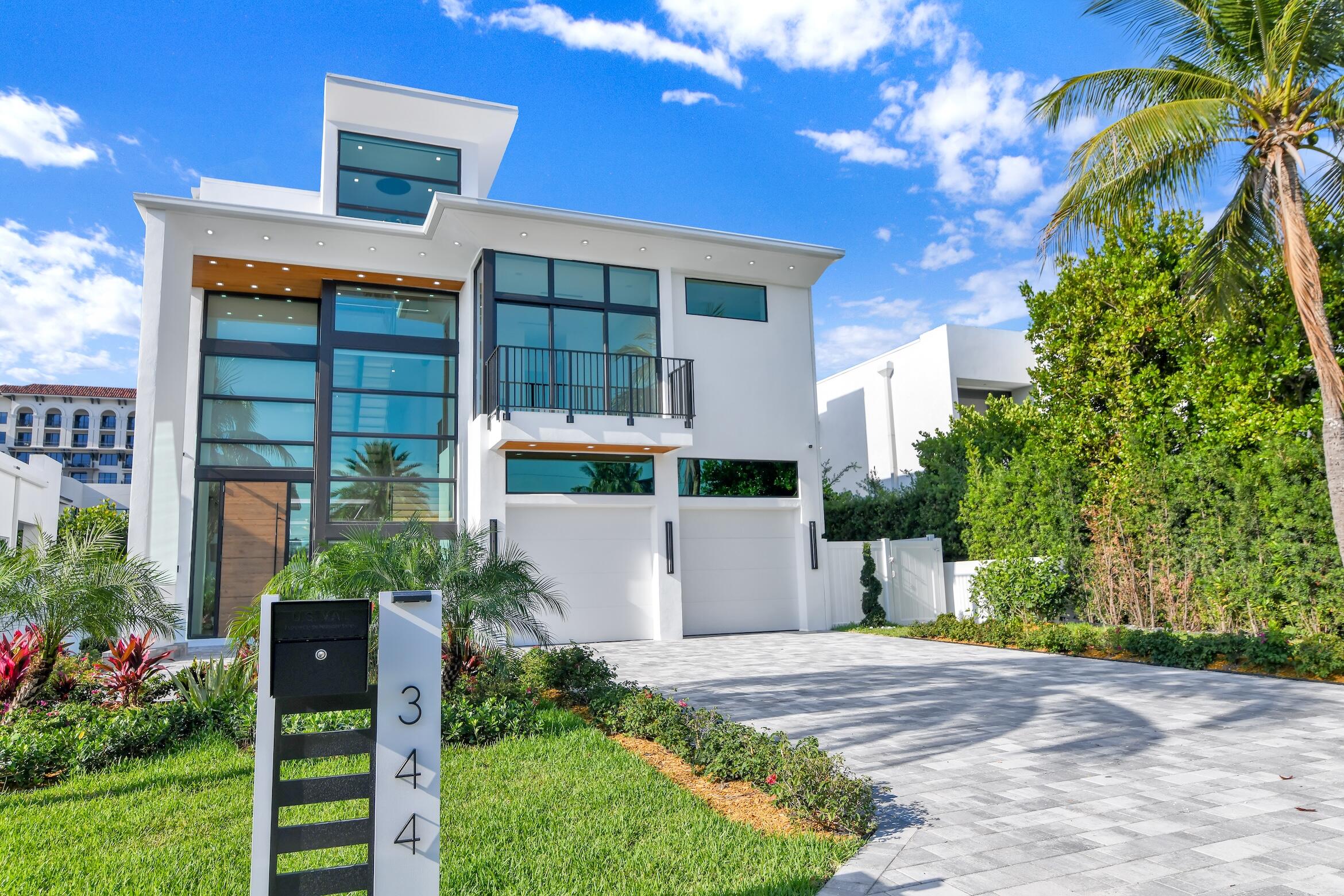 Experience elevated living in one of the most exclusive neighborhoods of Boca Raton, the Golden Triangle between Mizner Park and the ocean. This exceptional home offers a blend of modern elegance and cutting-edge design with a floor plan that features 5 spacious bedrooms, 6.5 full bathrooms, a powder room with a custom quartzite vanity, an Italian kitchen cabinetry with a beautiful lighted countertop, top-of-the-line appliances, two laundry rooms, a loft, custom LED lighting, and chandeliers throughout. The house also has a summer kitchen, a covered patio, a private elevator, a third-floor bar, a seating area, a game room, and a large terrace with a BBQ area and an integrated smart home system. Enjoy walking to Mizner Park, downtown Boca, restaurants, shops, and the beach.