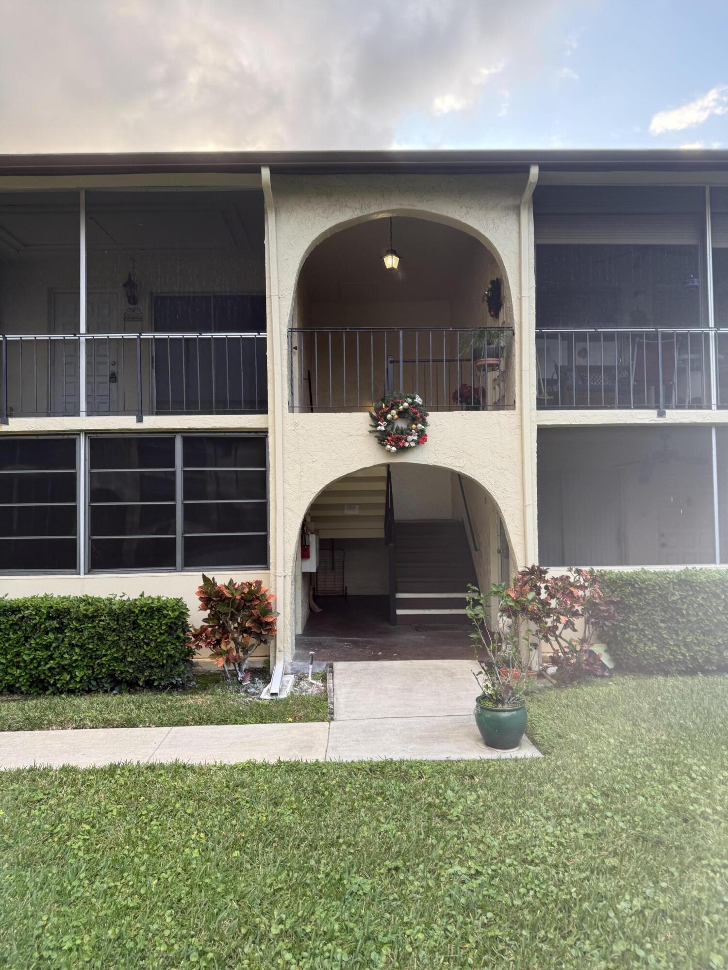 Welcome to La Pinata, a peaceful 55+ community. This 2-bedroom, 1.5-bath second-floor unit is attractively priced and ready for you to make it your own. Enjoy the enclosed front porch perfect for relaxing with morning coffee. Inside, you'll find new carpet throughout. The kitchen offers a large walk-in pantry, and there's an in-unit utility/laundry room with a washer and dryer. Community amenities include a pool, clubhouse, and shuffleboard. Move-in ready