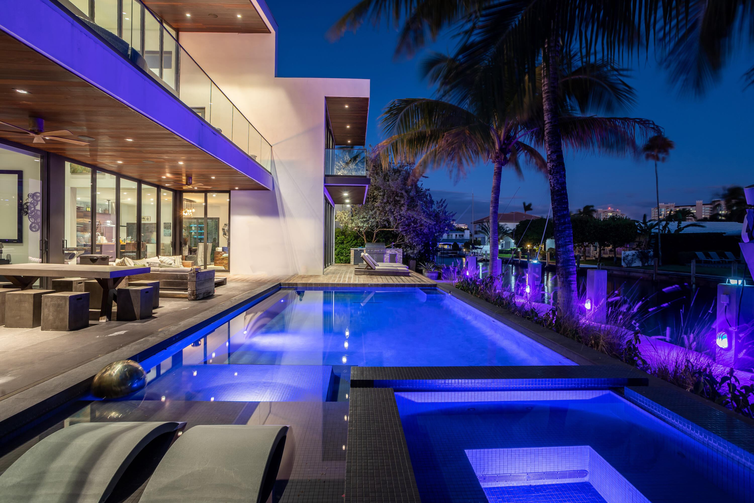This Stunning architectural masterpiece features waterfront freedom with no bridges to Intracoastal Waterway. A soaring great room ceiling with extensive glass is the immediate impact point upon entry with views the tropically landscaped  pool and patio with a dual wave runner lift and boat 40 ft mooring area. The kitchen with central island/seating services an open dining and family/media area. The first floor ensuite bedroom is currently the media room. The second story primary bedroom suite accesses two covered balconies. There are three additional second level ensuite bedrooms, two of which have balcony access; one is currently being used as an office. A spiral staircase connects the second floor covered patio with fire pit to the pool. See MORE for additional details Contemporary
Waterfront 80 Ft
Stone tile
Wooden double doors
Nest ac system
1000 gallon propone tank
Generator- full house - Propane
Full impact
Not garage door


Vaulted high ceilings
Floor to ceiling windows

Powder room
Bowl sink
Wooden floating vanity

Media Room
Can also be an additional bedroom
Overlooks pool and canal
Automatic drop down shades
Vision screen projector
Sony projector
Negotiable*

All TV negotiable
Artwork not included
Creston lighting system
Built in speakers through out
Aqualink  works with the app

Nest video surveillance

Kitchen
Wooden cabinets
Stone counter tops
Wolf wall microwave
Wolf oven
Refrigerator and freezer stainless steel
Built in wine cooler
Built in beverage drawers
Wolf gas range 5
Center Island
Built in hidden outlets
Stainless steel hood
Wooden counter top
Seats 5
Under island storage
ice maker
sub zero refrigerator
wine
Gas company
Oil & propane  Vero beach



Utility room
Electrolux front load washer and dryer
Storage cabinets


Patio
Outdoor furniture negotiable

Summer Kitchen
Outdoor mini Refrigerator

Dock
40 ft boat
Pool
34 x 15
Heated pool
Gas and electric hook up available
25000 boat lift included

Upstairs
Wooden stairs and metal
Steel rope railing
Bridge over looking the first floor

Upstairs Balcony
Glass railing
Gas fire pit
Metal circular stairs to pool area

Guest bedroom suite
Full wall closets

Bedroom suite

Maids quarter
Full bathroom
Not included freezer


Primary Room
Dual sink
Center island
Shower
Rain shower
Wall shower
Handheld
Water closet

Walk in closet
Island cabinets
Automatic drapes
Ceiling fan
Tub  jet spa
Wooden accent wall
Balcony covered
Double balcony doors
Outdoor shower
Garage door is not impact; has storm protection panels