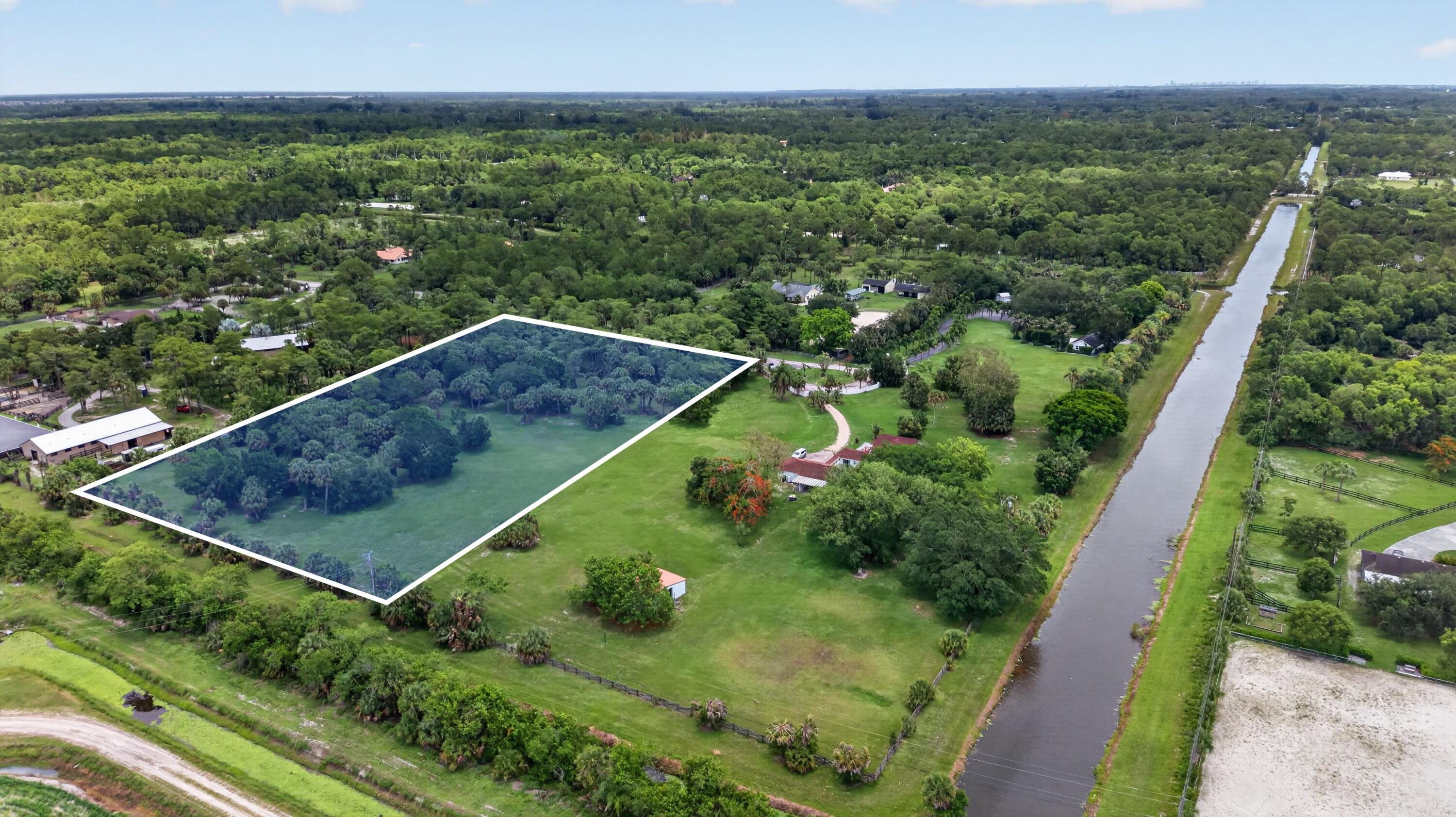 Discover the opportunity to build your dream estate or equestrian retreat on 5+ private acres within the gated Fox Trail community. Surrounded by expansive acreage properties and peaceful natural beauty, this vacant parcel offers endless potential for custom residential, equestrian, or investment use.  Conveniently located near Lion Country Safari, the rapidly growing communities of Westlake, Arden the future  Silver Lake and Village Landing development, with access to Wellington International and approx 30 mins to the heart of Palm Beach, this is a rare opportunity to secure land in an area experiencing continued growth, development, and demand.  Perfect for full-time living, seasonal enjoyment, equestrian pursuits, or future investment potential. Additional opportunity available with two adjoining properties also being offered for sale at 1029 Arabian Drive and 1030 Arabian Drive -- creating exceptional potential for assemblage, a larger equestrian estate, family compound, or long-term investment opportunity.
