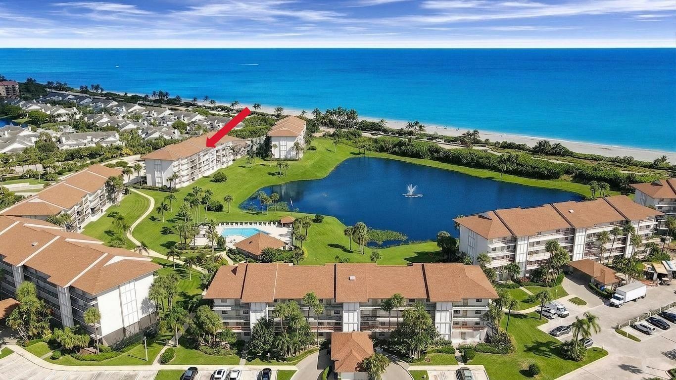 Top floor living with breathtaking, unobstructed ocean views - this is one of the most beautiful condos ever offered in Bluffs Ocean South. Overlooking the crystal clear aquamarine waters Jupiter is famous for, this fully renovated 2BD/2BA residence delivers a luxurious coastal lifestyle with every detail thoughtfully upgraded. Step inside to an incredible top to bottom renovation, an exceptional high end kitchen, two spa inspired bathrooms and spacious bedrooms designed for comfort and style. The open living space flows seamlessly to a private balcony - the perfect backdrop for morning coffee or sunset unwinding. The laundry room offers extra storage, sink, stackable washer/dryer and large space for storage, an office, or bunk room. Beautiful Ethan Allen furnishings will be included. This renovation doesn't just include surfaces. Every door, piece of hardware, every light switch, baseboards, door casings, and lights have been replaced with high quality materials. High hat lighting has been added throughout and full impact glass windows and sliders have been installed to provide peace of mind. This combination creates an effortless turnkey opportunity so don't wait! Enjoy this stunning home this winter and start living the beachside lifestyle you've dreamed of.  Bluffs Ocean South is a gated oceanfront condo community in Jupiter made up of seven midrise buildings, each with 30 units, for a total of 210 residences overlooking the Atlantic and the community's serene lake. Every building is positioned to maximize ocean breezes and views, creating a true coastal living experience. Residents enjoy direct beach access, a resort style pool, tennis court, on site management, and beautifully maintained grounds. Its prime location is a major draw - steps to Jupiter's wide beaches and within minutes of Publix, restaurants, coffee shops, parks, and the Juno Beach Pier. With Palm Beach International airport just 25 minutes away, this location makes it ideal for both seasonal and year round living. Whether you're seeking a primary residence or a lock and leave second home, this condo offers unmatched beauty, convenience, and value in one of Jupiter's most coveted beachfront communities.