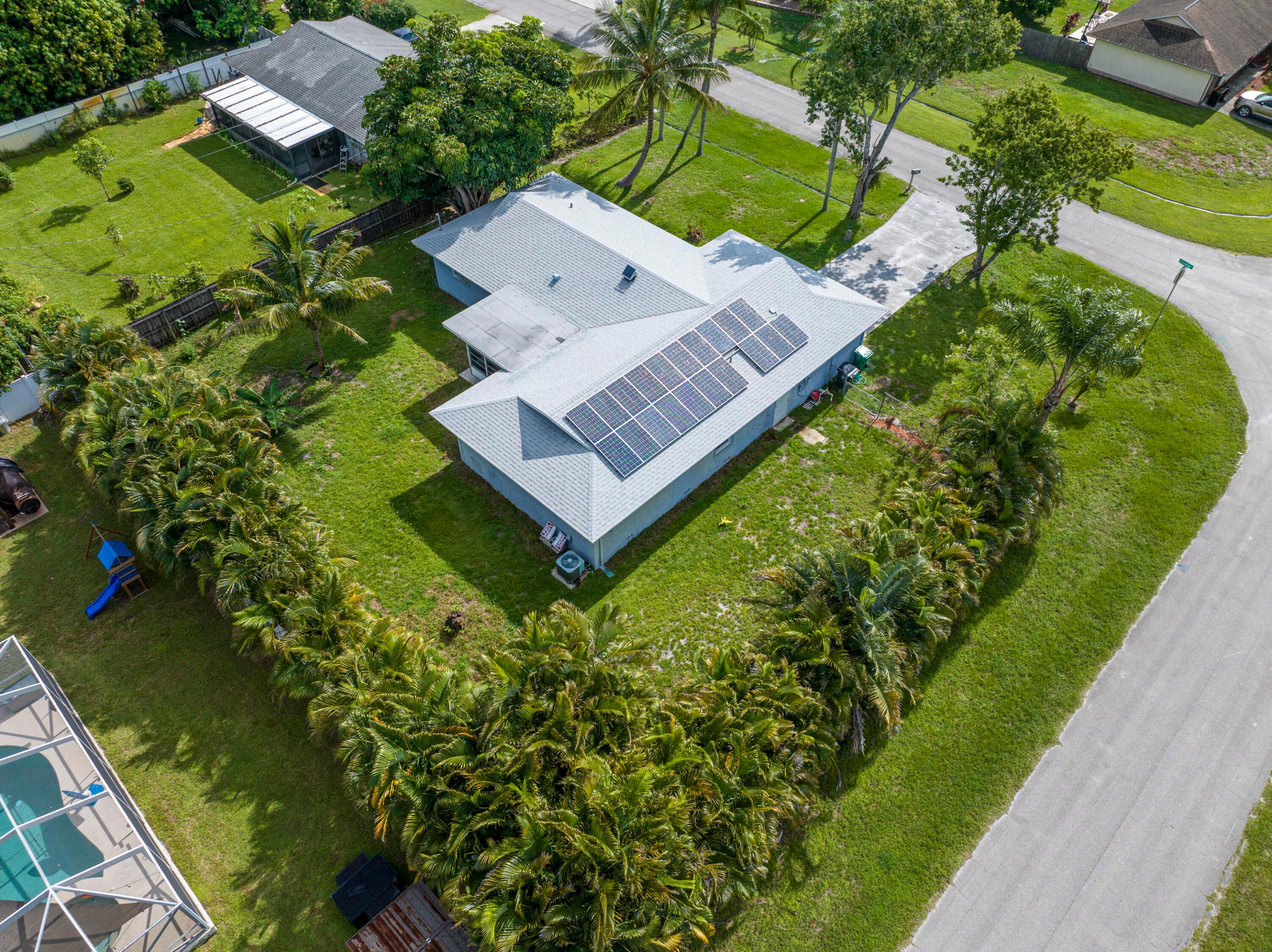 Port St Lucie Paradise: Room to Grow! Imagine your perfect Florida lifestyle in this beautiful split floor plan, nestled on a lush corner lot. 


Step inside and feel the bright living spaces in every room of the house. This 3/2/2 floorplan creates privacy, while the bonus room flexes to your lifestyle. Picture mornings on your covered patio, evenings lounging in your fully fenced landscaped yard, or hosting weekend BBQ's beneath the swaying palms. Plenty of room to add the pool of your dreams!


This home isn't just move in ready-its turn key. The modern upgrades include granite counter tops, stainless steel appliances, LVP flooring, a newer roof (2023) and paid off solar panels!


Don't miss this perfect family home, only a 10 Minute Drive to St Lucie West and highways.