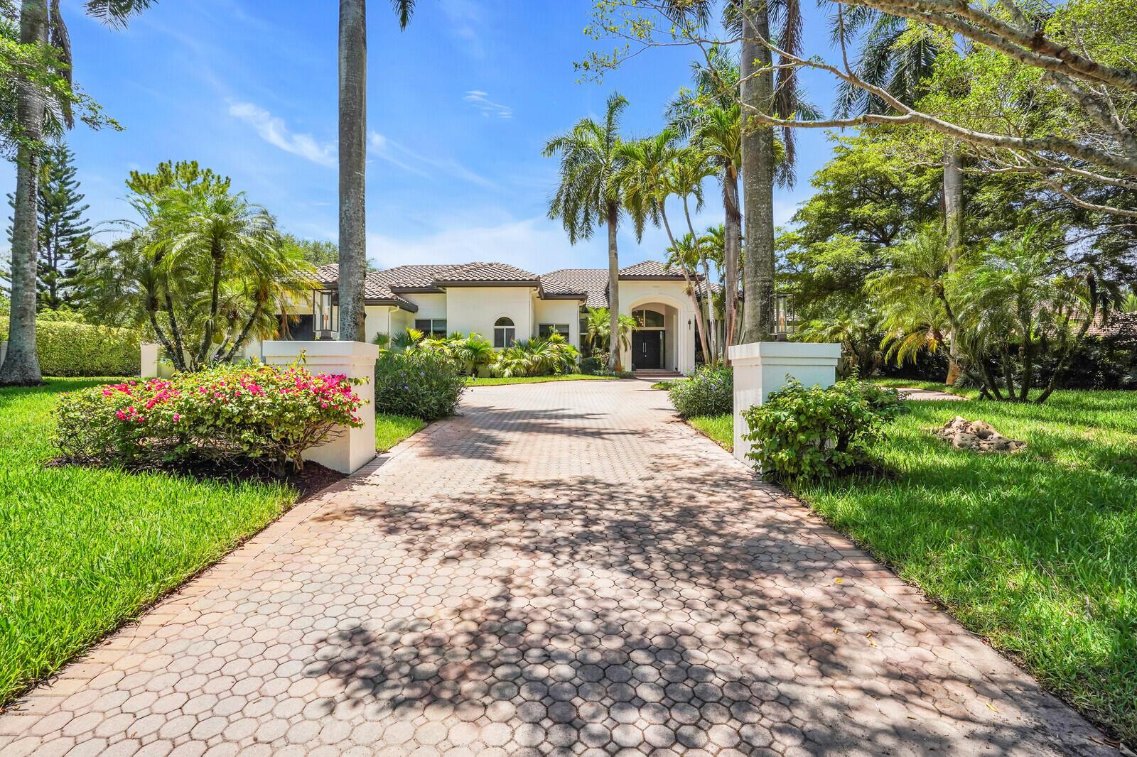 Huge price reduction in Long Lake Estates! Now offered at $3,975,000 (down from $4,450,000 and originally $4,950,000), this incredible estate sits on a rare one-acre lot—something you just don't find every day. At this price, it's an exceptional opportunity and absolutely worth seeing. Luxury, Privacy & Space—All in 1 Extraordinary Estate. Welcome to 5,700+ SF of elegant, single-story living in  this 2025 renovated white-oak kitchen masterpiece & guest baths. This 7 BD/7.5 BA home includes a separate 2 BD/ 2BA guest house w/ Full size Living Room, kitchen and office nook  —perfect for guests or extended family. Enjoy soaring ceilings, 5 BD/ 5.5 BA plus media room, and office off the resort-style master w/ 3 walk-ins &  separate his/her baths in the main house. Nestled on 1+ lush acres w/ resurfaced tennis court & 4+ car garage. Enjoy easy access to Boca Raton's premier shopping, dining, and top private and public schools.. This boutique-style community epitomizes refined living and luxurious amenities.
