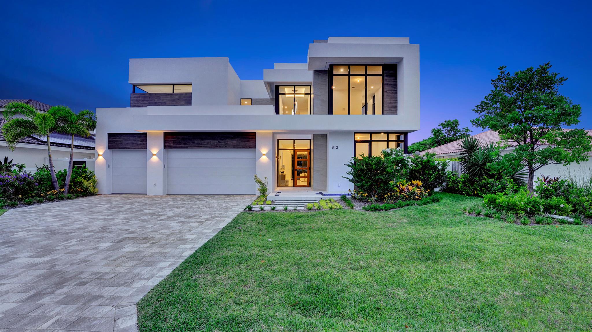 A masterpiece of modern design by acclaimed builder Core 4 Homes, this brand-new coastal residence is perfectly positioned just two blocks from private beach access in the exclusive neighborhood of Spanish River Land. Offering the ultimate blend of luxury and location, this home sets a new standard for refined seaside living. 

Designed with thoughtful detail and high-end finishes throughout, the home offers over 4,400 square feet of living space, including five bedrooms and five bathrooms. A downstairs guest suite adds flexibility, while each upstairs bedroom features its own private en-suite bath.

From the moment you arrive, the home makes a bold first impression—floating entry steps, lush tropical landscaping, and a peaceful water feature set the stage for what's inside. At the heart of the home, a chef's kitchen shines with custom cabinetry, Miele gas appliances, and a unique transom window that brings in soft natural light and garden views. The oversized island connects seamlessly to the open dining and living areasideal for both entertaining and everyday living.

Soaring windows frame the sunlit living space and lead to the outdoor oasisa covered patio stretches nearly 50 feet, overlooking a resort-style pool, spa, and sun shelf designed for ultimate relaxation.

Take the elevator upstairs and find a cozy loft and four additional bedrooms, including a primary suite that offers a peaceful escape. Enjoy a spa-inspired bathroom with a soaking tub, dual walk-in closets, a morning bar, and a private water closetall designed with clean, minimalist elegance.

812 Malaga is more than a home,it's a statement of modern luxury in one of Boca Raton's most coveted coastal communities. Schedule your private showing today and experience elevated beachside living at its finest.