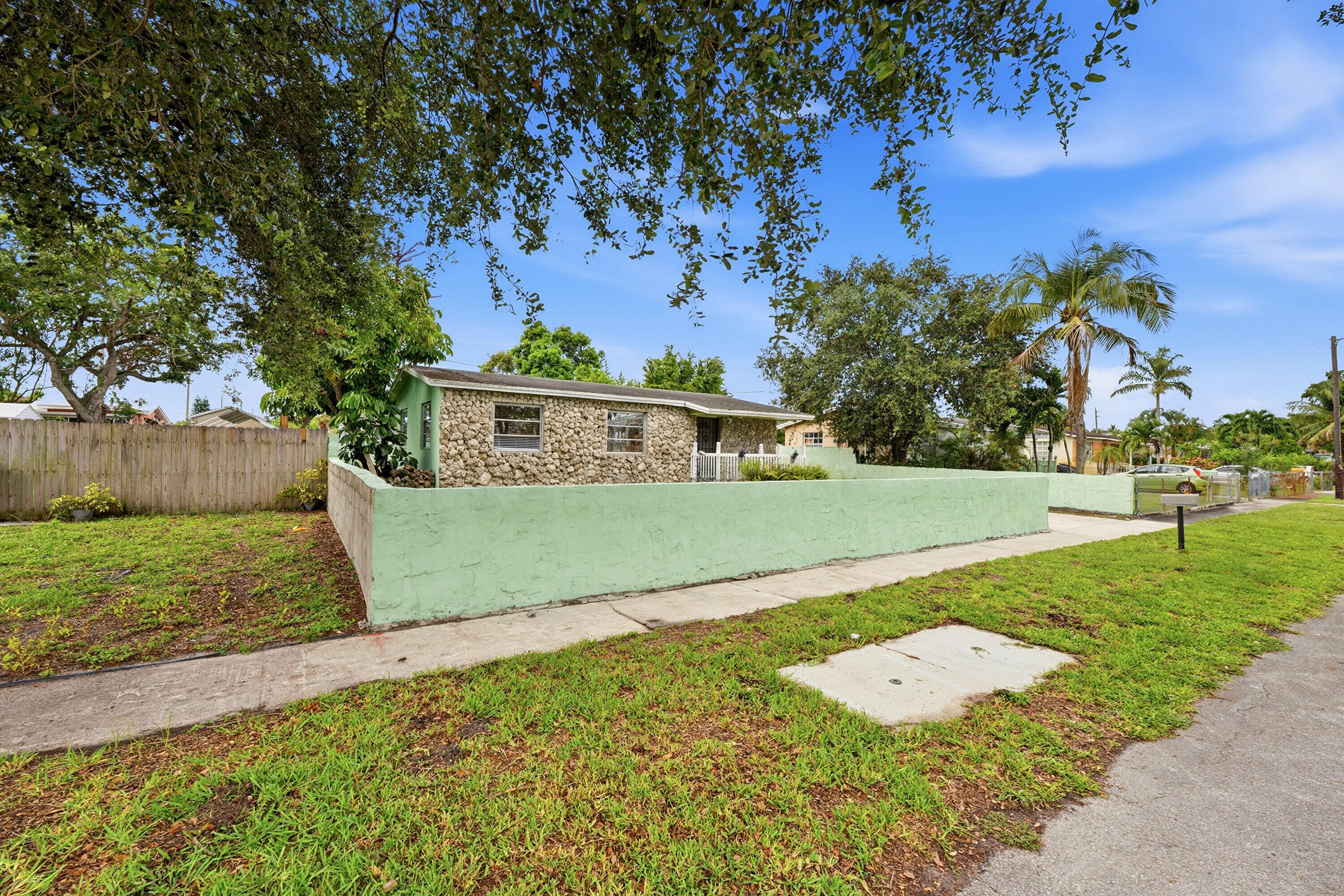 No homeowners association !  A Charming and beautifully maintained 2-bedroom, 1-bath single-family home with a bonus office, situated on an oversized,  fenced lot in a highly desirable location just minutes from the world-famous Hard Rock casino  This quaint, cozy home is move-in-ready and  offers approximately 1,100 square feet of comfortable living space and is perfect for first-time homebuyers, downsizing , or anyone seeking an affordable South Florida lifestyle. Recent updates and renovations provide modern appeal. Enjoy peace of mind with a newer A/C system installed in 2020. The spacious yard offers endless possibilities for entertaining, pets, gardening, expansion, or storing recreational equipment. Conveniently located near major highways, shopping, dining, entertainment