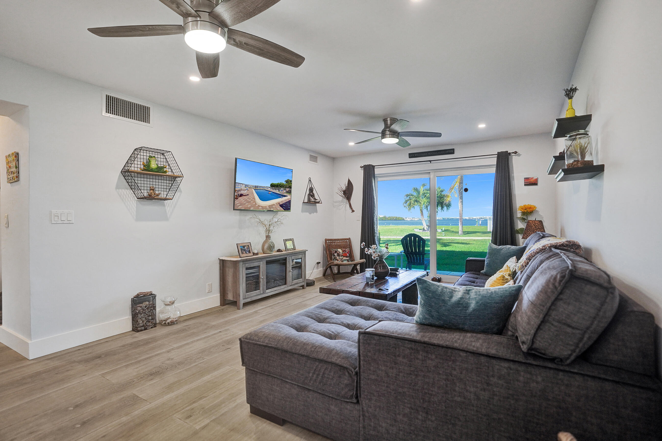 Direct Intracoastal views set the stage for this stunning 2-bedroom, 2-bath waterfront condo. Located on the first floor, this beautifully renovated residence offers a true beach house feel just steps from the pristine sands of Lantana Beach, as well as nearby restaurants and boutique shops. The interior showcases a modern coastal design with bright, airy living spaces and high-end finishes throughout. Enjoy peaceful water views from your private patio, or relax by the community pool. Outdoor enthusiasts will appreciate the nearby fishing bridge and nature preserve, perfect for embracing Florida's natural beauty. Whether you're looking for a serene coastal retreat or a full-time residence, this exceptional condo delivers the best of waterfront living. Come see this unit!