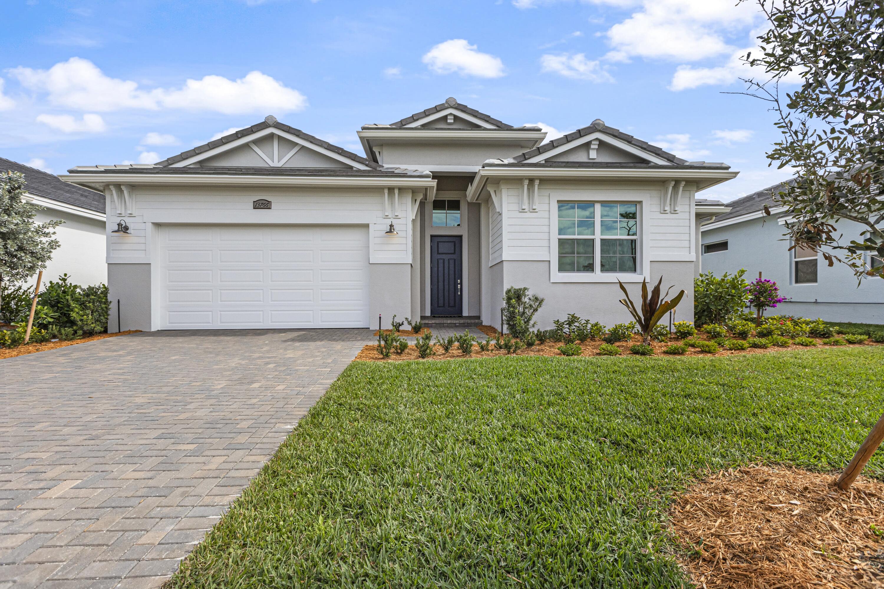 Move In Ready! Beautifully designed and move in ready, this 4 bedroom, 4 bathroom Nicole Home in Mosaic offers modern elegance and everyday comfort. Step into a thoughtfully designed space with premium structural upgrades, including a Covered Expanded Lanai, with a 10' sliding glass door to let all the natural light in the open concept living, perfect for indoor-outdoor Florida living. The kitchen features 30" GE Profile gas cooktop, built in wall oven and microwave combo, quartz countertops, soft-close cabinetry, and an oversized island overlooking the great room. Mosaic residents have access to resort story amenities, including the pool, fitness center and pickleball, all minutes form I-95, dining, and shopping.