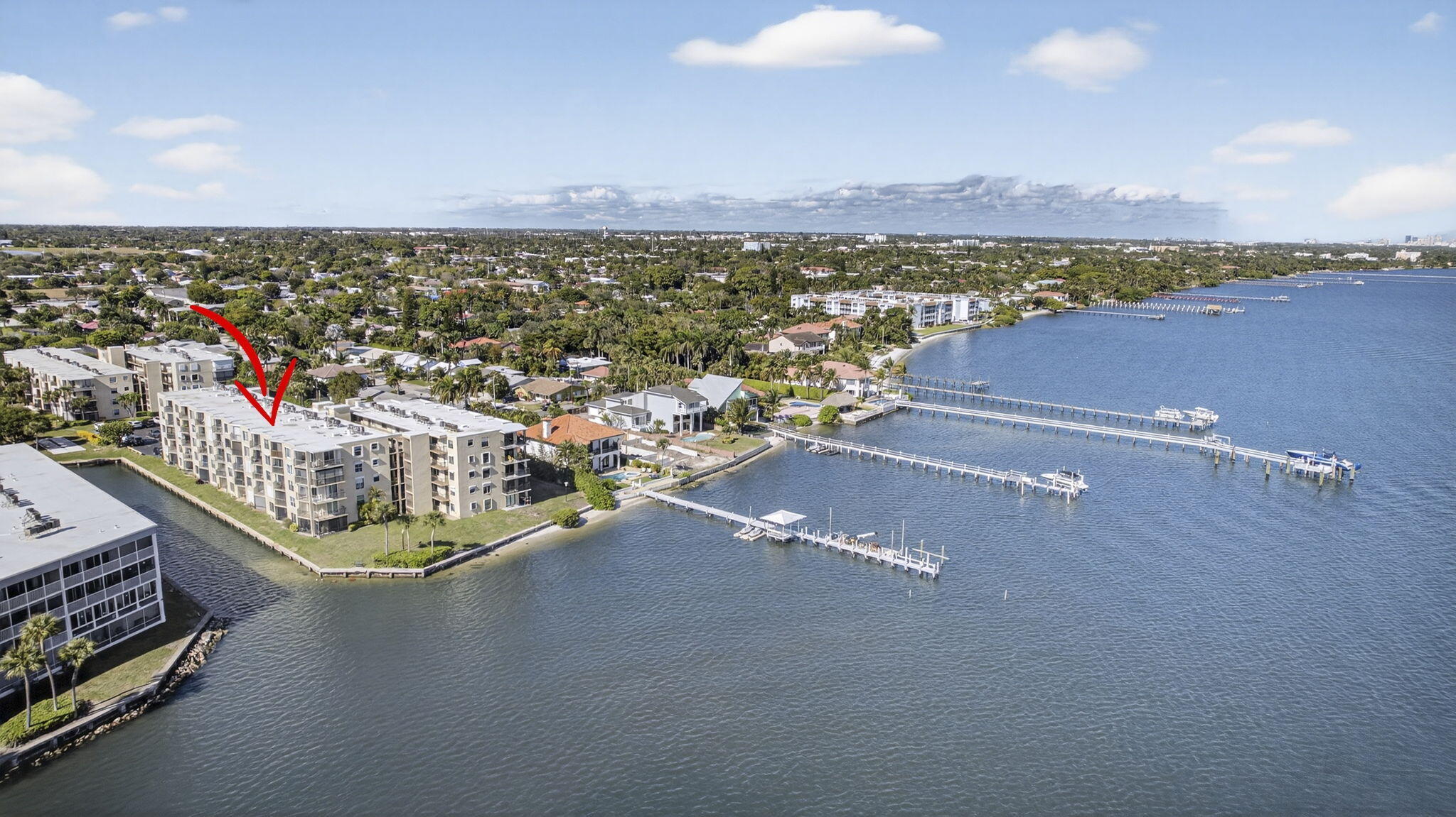 Move-in ready and offered fully furnished, this beautifully maintained 2-bedroom, 2-bath end-unit condo captures the essence of relaxed coastal living. Situated on the second floor, the home opens to a spacious private balcony overlooking tranquil canal views that flow into the Intracoastal Waterway--an ideal setting to enjoy the sunrise and your morning coffee or unwinding at sunset. Inside, you'll find a bright, open layout filled with natural light, along with the convenience of an in-unit washer and dryer--perfectly suited for easy, breezy coastal living.  Set within a gated Intracoastal community, residents enjoy resort-style amenities including a pool and clubhouse. Assigned parking plus ample guest spaces provide ease for everyday living and entertaining. Small pet permitted, and leasing is allowed with some restrictions. An ideal full-time residence, seasonal escape, or investment opportunity, just bring your suitcase and start enjoying the lifestyle.