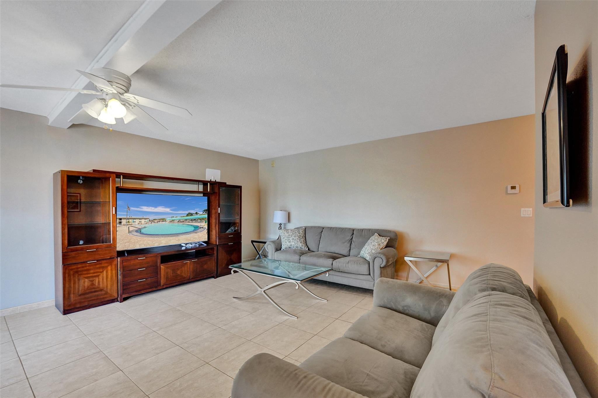 EAST OF US 1! Beach lovers can walk or bike ride to the beach less than a mile away. Peaceful community surrounded by the Echo Golf Course. Ideal for year round living or as a 2nd home. Updated 1 bedroom/1 bathroom located on the 2nd and top floor. No noise above you. All tile floors. Central a/c. Tankless water heater. Active 55+ complex that boasts an amazing infinity pool, bocce courts, clubhouse with library, gym, pool table. Plenty of social activities. Low monthly maintenance fee $325/mo and a small annual share for rec facility $540/yr or $45/mo. That is $370/monthly total. No leasing & no pets. One assigned parking space and guest parking available. Updated 1/1 East of US1. Priced to sell