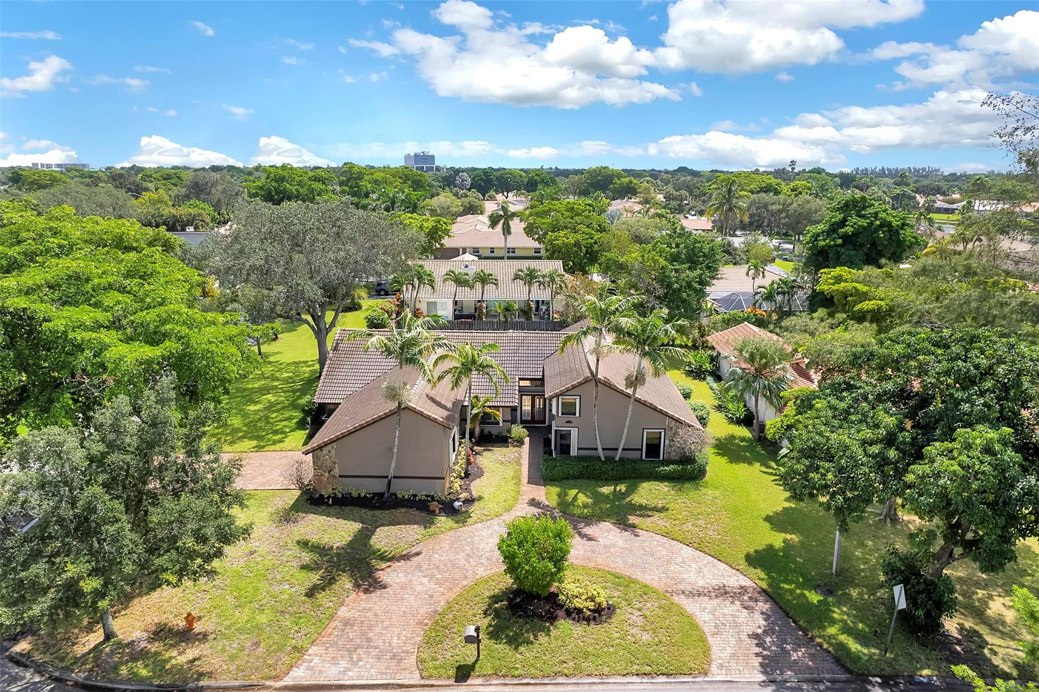 Welcome to this amazing 4-bedroom, 2.5-bath home in the heart of Coral Springs! This unique one-story residence features an open great room design with a striking spiral staircase leading to a versatile loft—perfect for a home office or media space. The contemporary kitchen flows seamlessly into the living areas, complemented by beautifully upgraded bathrooms. Step outside to an extra-large patio ideal for entertaining, overlooking a sparkling pool and fenced yard for added privacy. With two paver driveways, there's plenty of parking and curb appeal. Located in a prime area with great schools, shopping, and dining nearby—this home truly has it all!