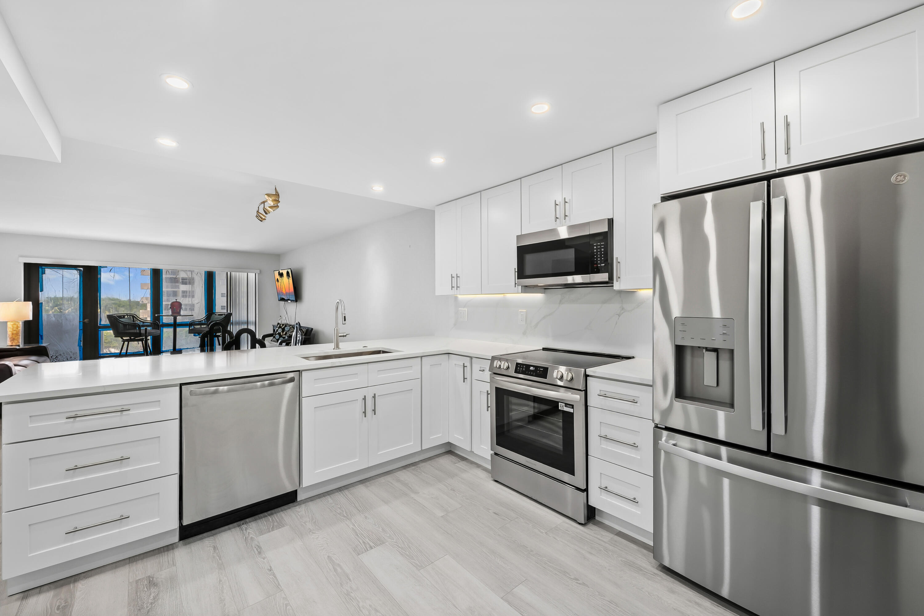 Just renovated and move-in ready, this beautiful beachfront condo offers the perfect South Florida lifestyle. The tastefully redesigned interior features an open kitchen with white quartz countertops, shaker-style cabinetry, stainless steel appliances, oversized sink, and ample space for entertaining. Luxury vinyl flooring flows throughout. The primary suite includes dual vanities, a tub/shower combination, and a large walk-in closet. Washer and dryer in unit. Large non impact windows fill the home with natural light, while the spacious balcony offers ocean views. Resort-style amenities include fitness center, game room, community room, 3 pools, 8 tennis/pickleball courts, putting green, dog parks, beachfront cabanas, grills, and herb gardens on 14 acres of oceanfront. Truly one of a kind.