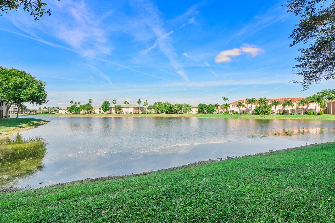 Welcome to this beautifully maintained Waterfront 2 bedroom, 2-bath Southhampton home in desirable Kings Point (55+). This spacious first-floor residence offers a split-bedroom floor plan, oversized bedrooms, abundant closet space, and spectacular sunset skies from the screened patio. Impact windows/doors provide added peace of mind.  The updated kitchen features; upgraded cabinetry, newer fridge, SS appliances. Full-size W/D. Private gated front patio adds privacy to your home.   Enjoy a resort-lifestyle including; A 24 hr. manned gate, clubhouse, swimming pools, theater, pickleball, free transportation, and many social activities. HOA includes; cable, water, internet and pest control.