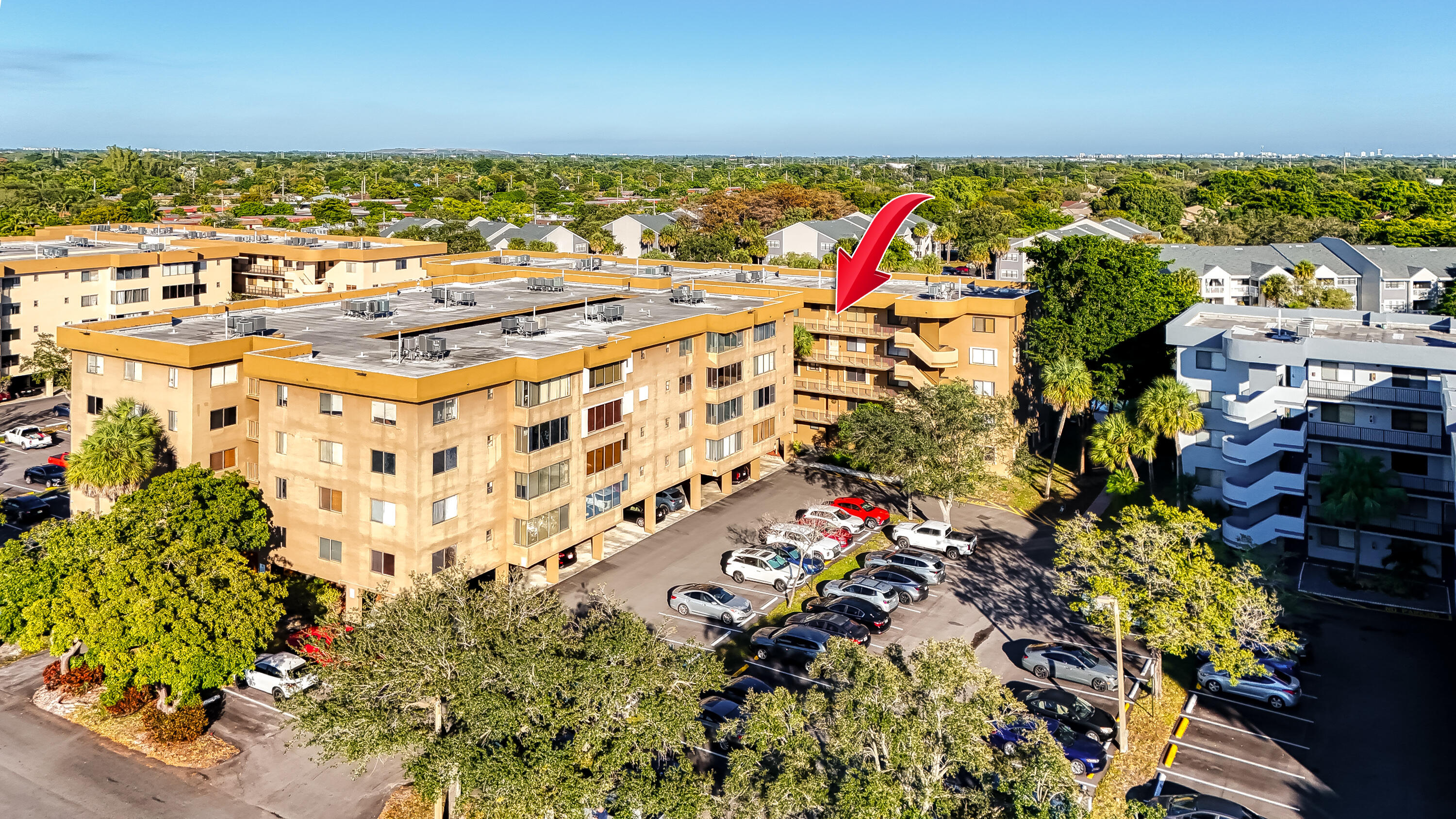 Spacious 2BR, 2-bath condo with 1,350 sq ft of living space with lake views. Located on the 5th (top) floor, in a quiet gated, all-ages community. Walk in Closet. Laundry/storage room inside of the unit adds extra convenience. Resort-style amenities - 2 pools, clubhouse, tennis courts, and a fitness center. The monthly HOA is $522.58 Dorado Condominium Association and $125.00 to Hamptons West Master Association. The total is $647.58. This price includes internet, Xfinity cable, water, sewer, trash, pest control, and exterior insurance. HOA requires a minimum 650 credit score. No rentals allowed during the first 2 years. After that only 1 lease per year is allowed. No motorcycles, commercial vehicles, mobile homes, etc. Only 1 assigned parking space per unit. Parking spot #13 under cover comes with this unit. No more than 4 occupants per 2BR unit. Pets are not allowed. Centrally located near Turnpike, I-95, Hampton Pines Park, shopping, dining, and beaches.